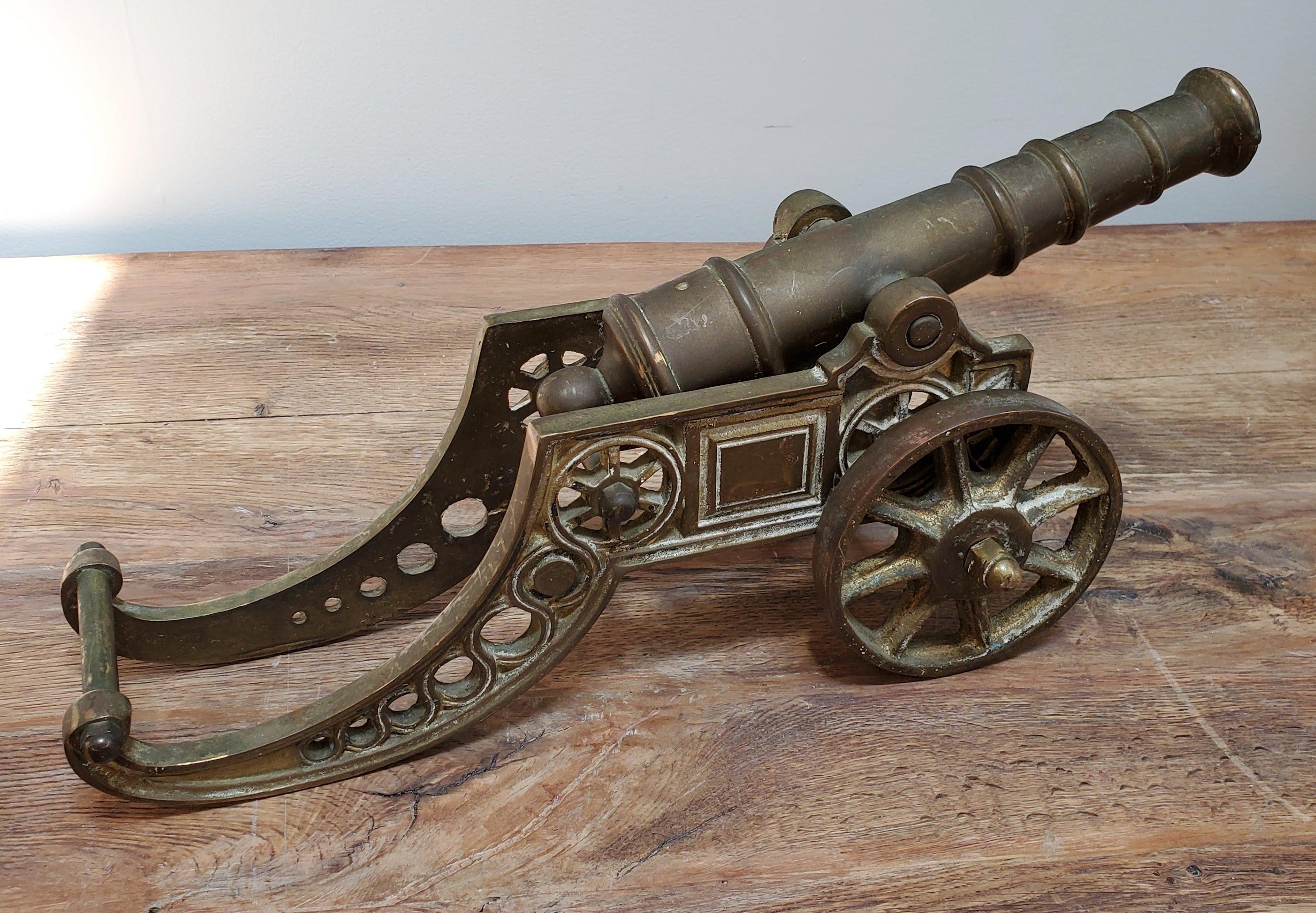 miniature brass cannon on wheels