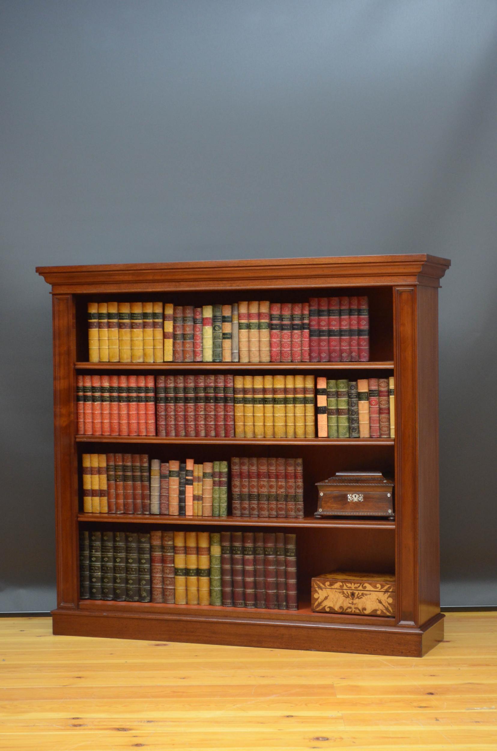 Sn4925 fine quality Victorian open bookcase in solid mahogany, having figured mahogany top above three height adjustable shelves flanked by moulded pilasters, all standing on moulded plinth base. This antique bookcase has been sympathetically