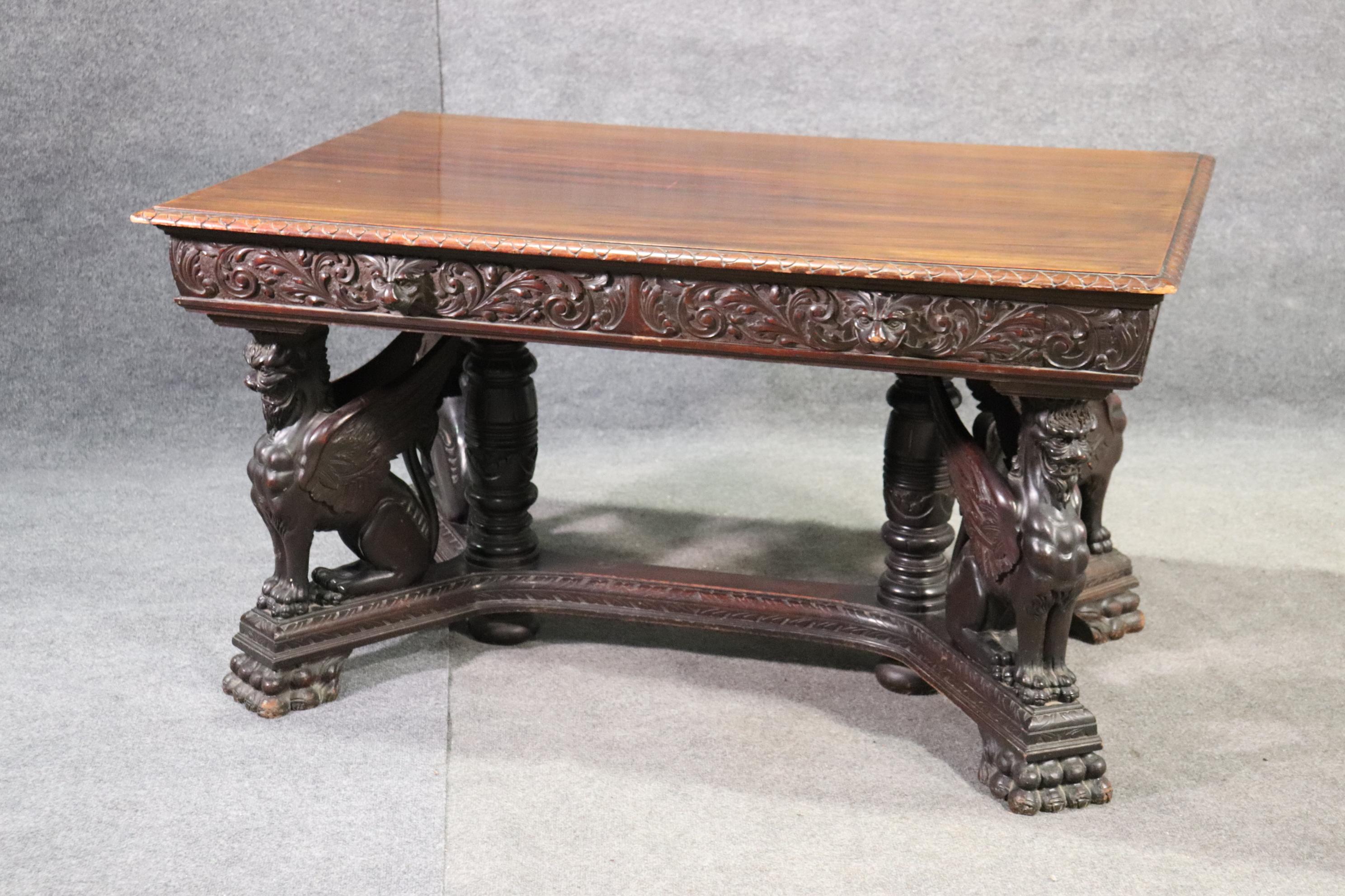 This is one of RJ Horner's most iconic designs. The winged griffin desk with it's incredibly carved griffins guarding the corners of the desk and the unique faux drawer on each side and one working drawer configuration was a unique feature Horner