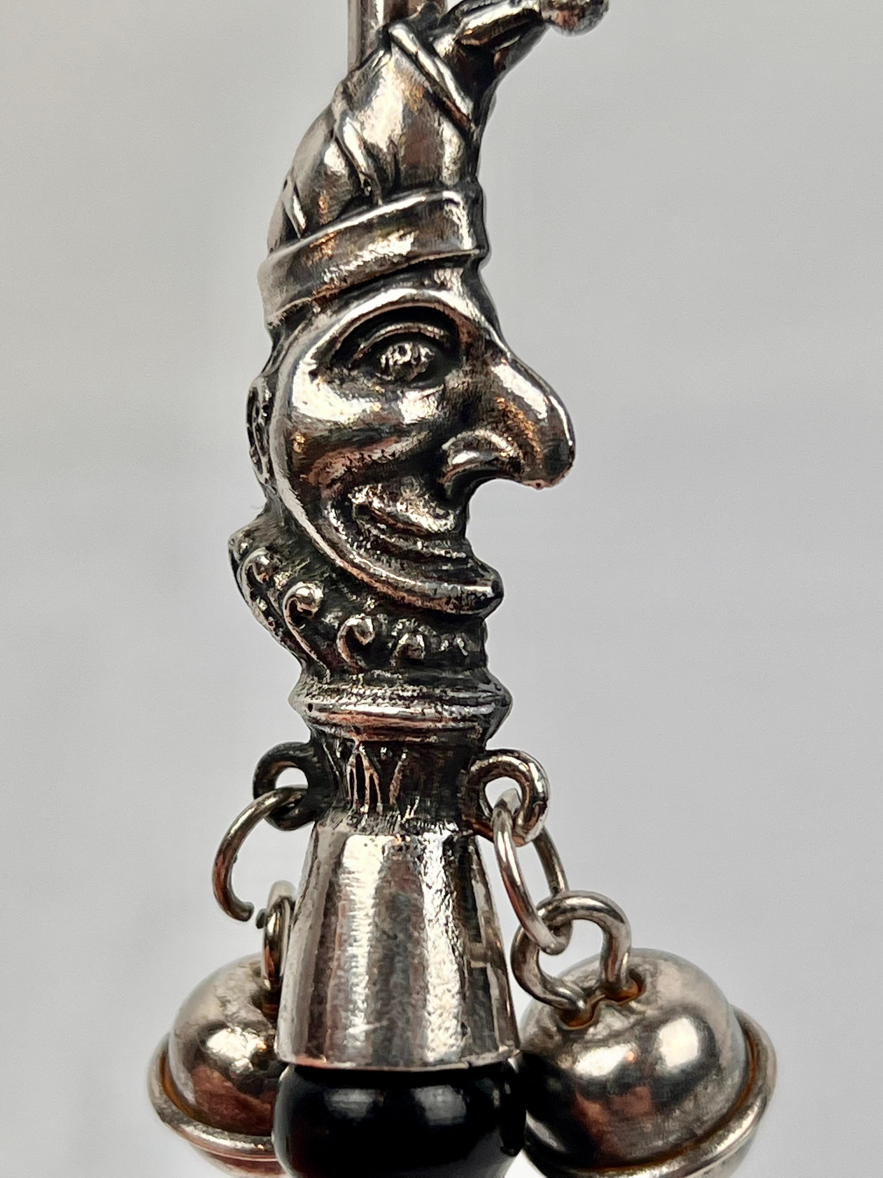English The Jester, a Victorian Solid Silver Form Baby Rattle with Ebony Turned Handle