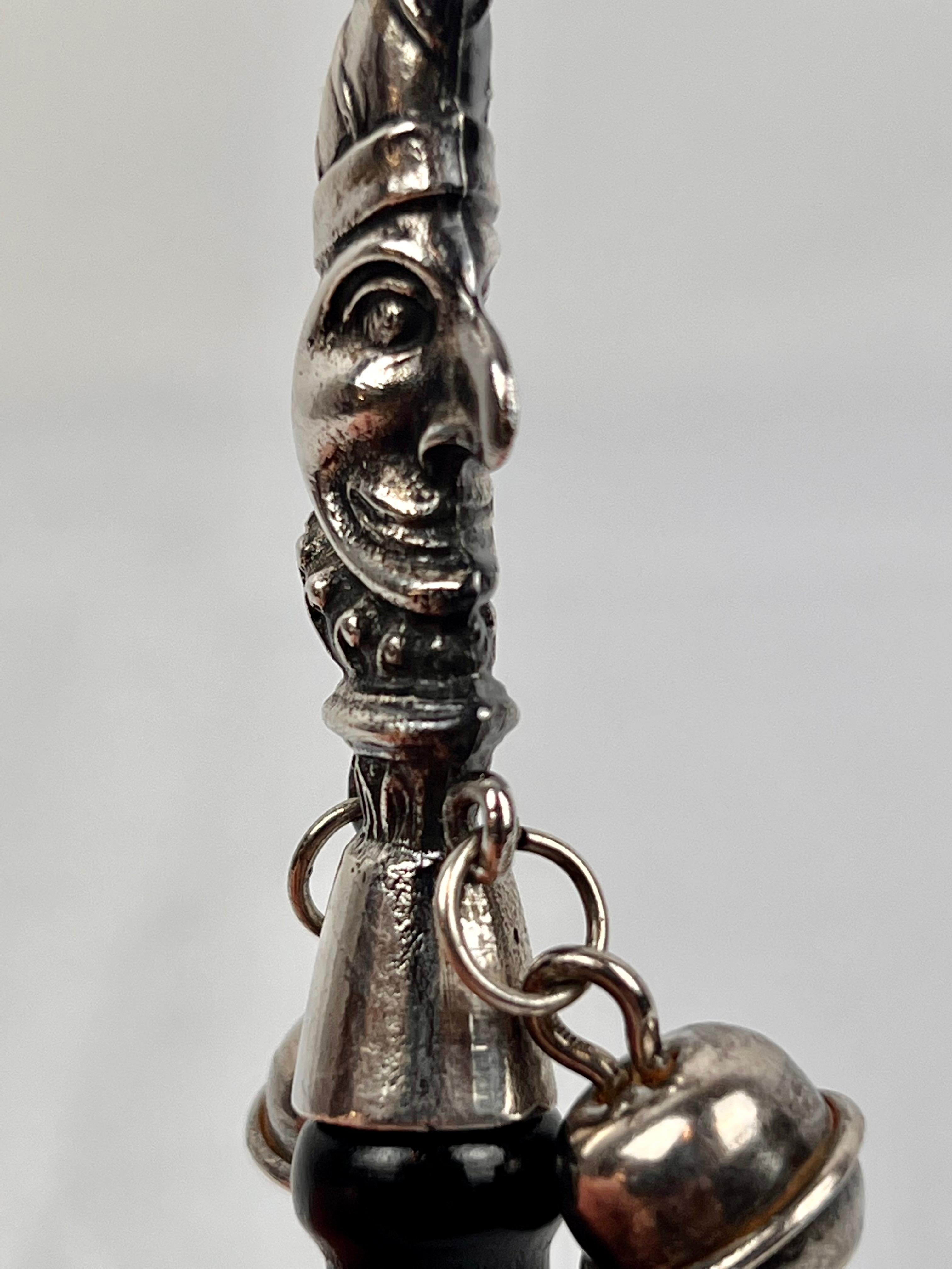 Late 19th Century The Jester, a Victorian Solid Silver Form Baby Rattle with Ebony Turned Handle