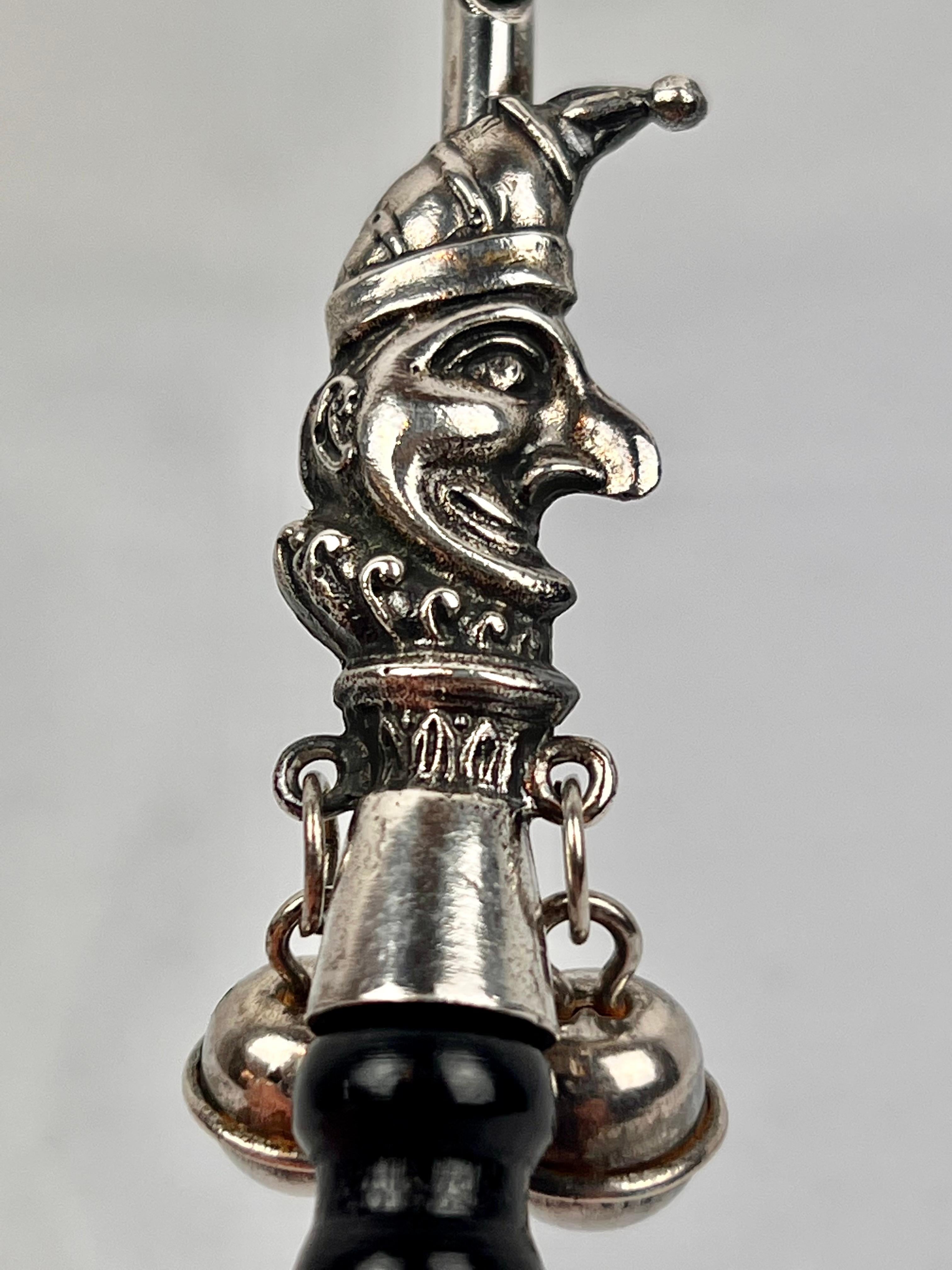 The Jester, a Victorian Solid Silver Form Baby Rattle with Ebony Turned Handle 1