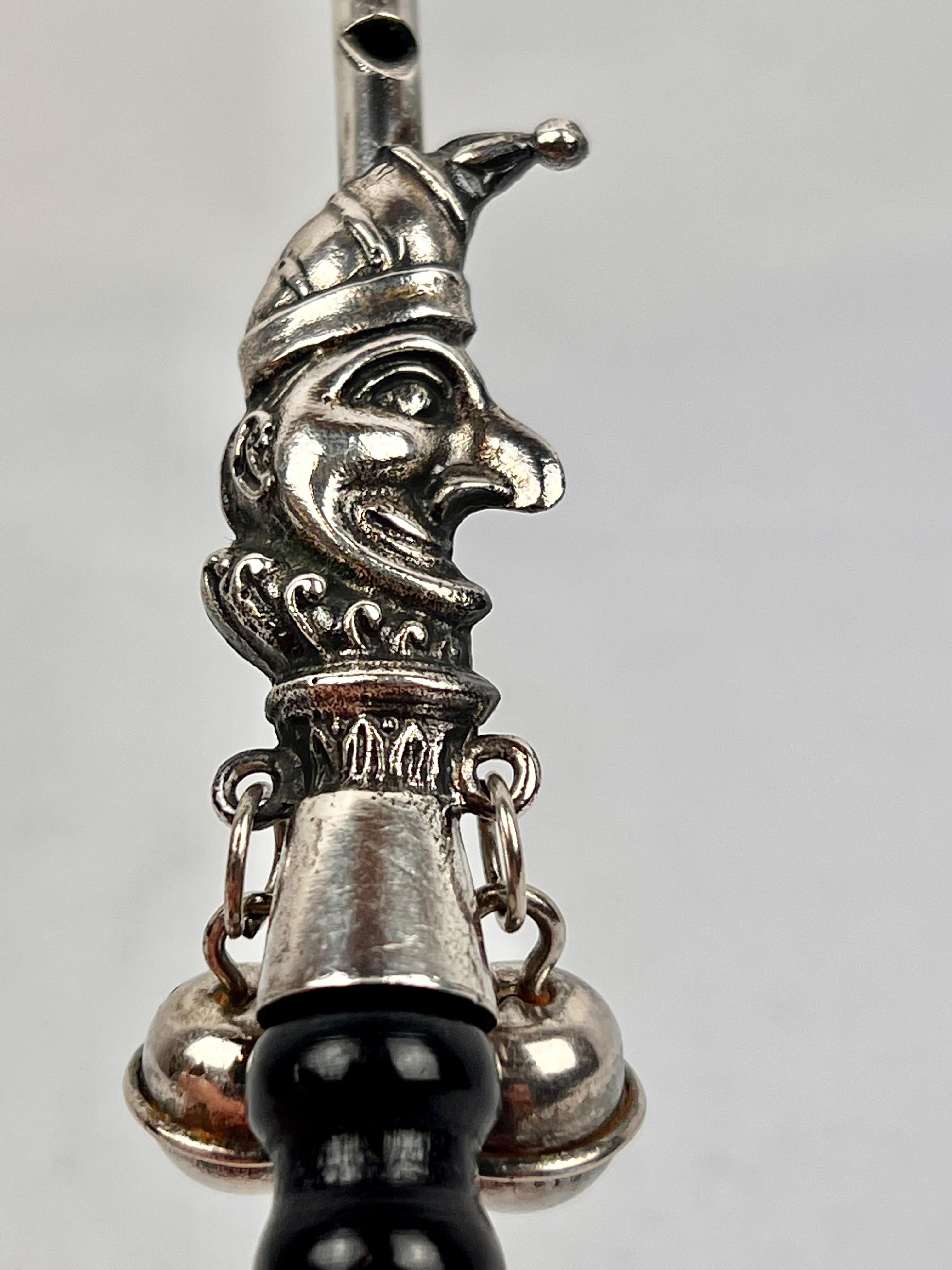 The Jester, a Victorian Solid Silver Form Baby Rattle with Ebony Turned Handle 2