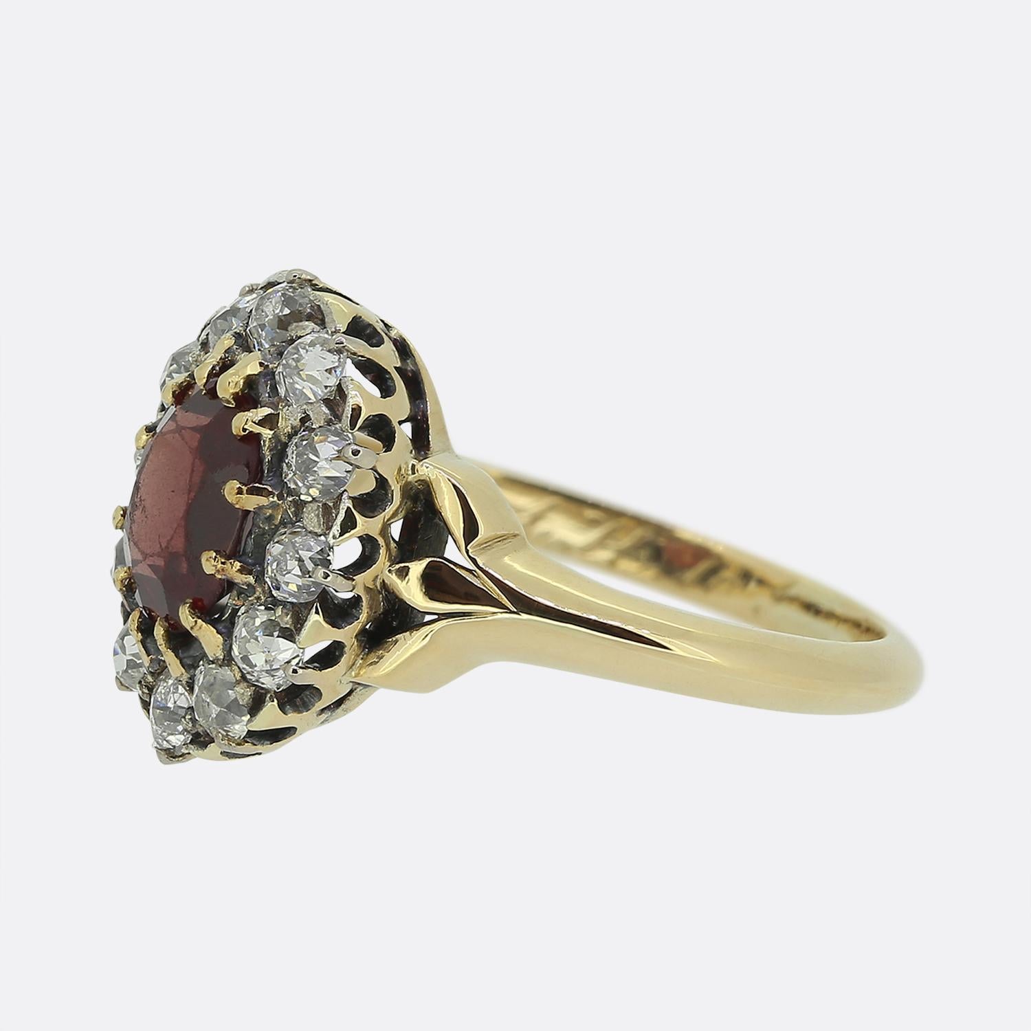 Here we have a wonderful Victorian spinel and diamond cluster ring. The central spinel is a highly desirable pigeon blood red hue with a slight orange undertone. The surrounding old cut diamonds are a bright white colour and sit slightly below the