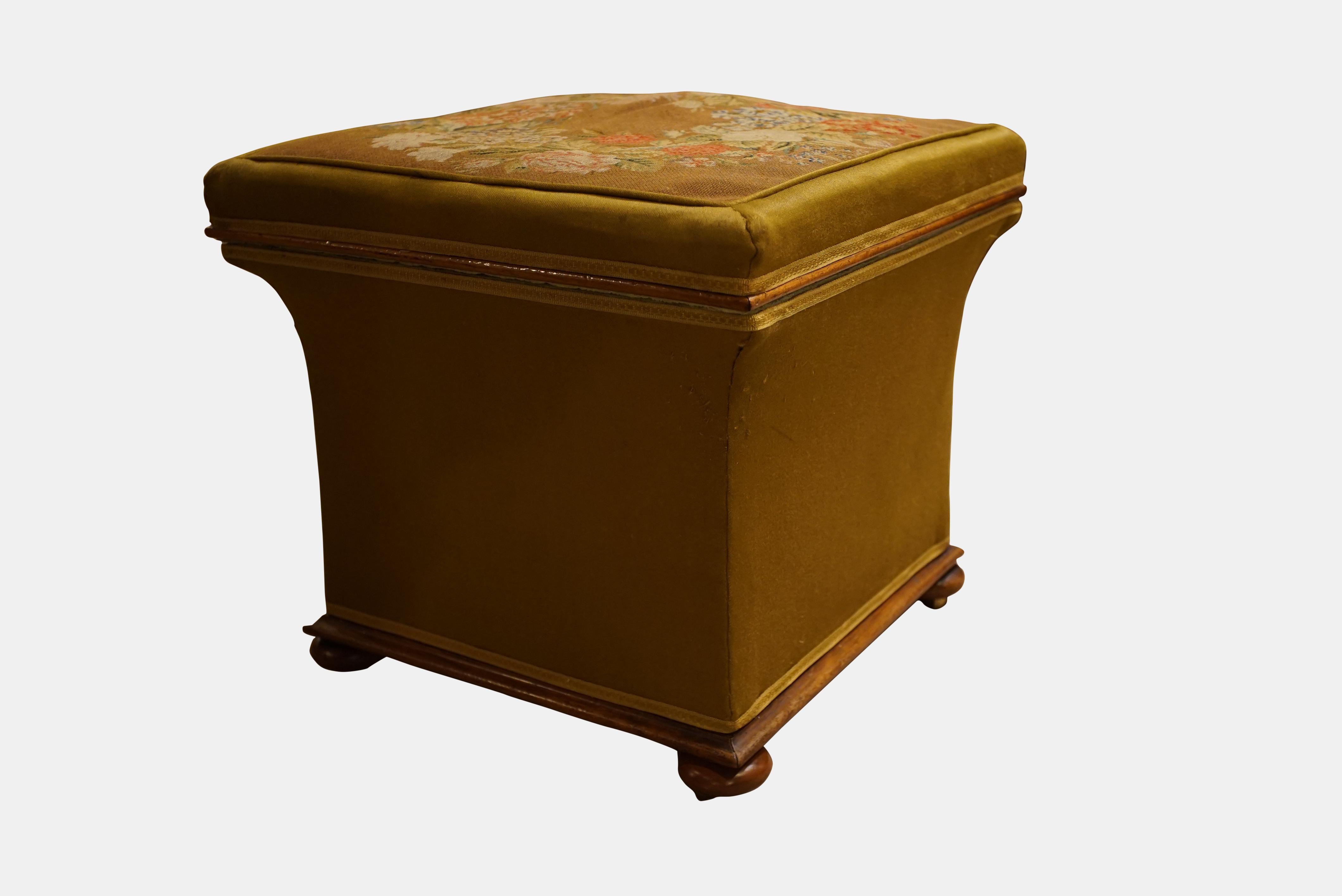 A Victorian Square Concave Sided Stool with a hinged top in Berlin needlework