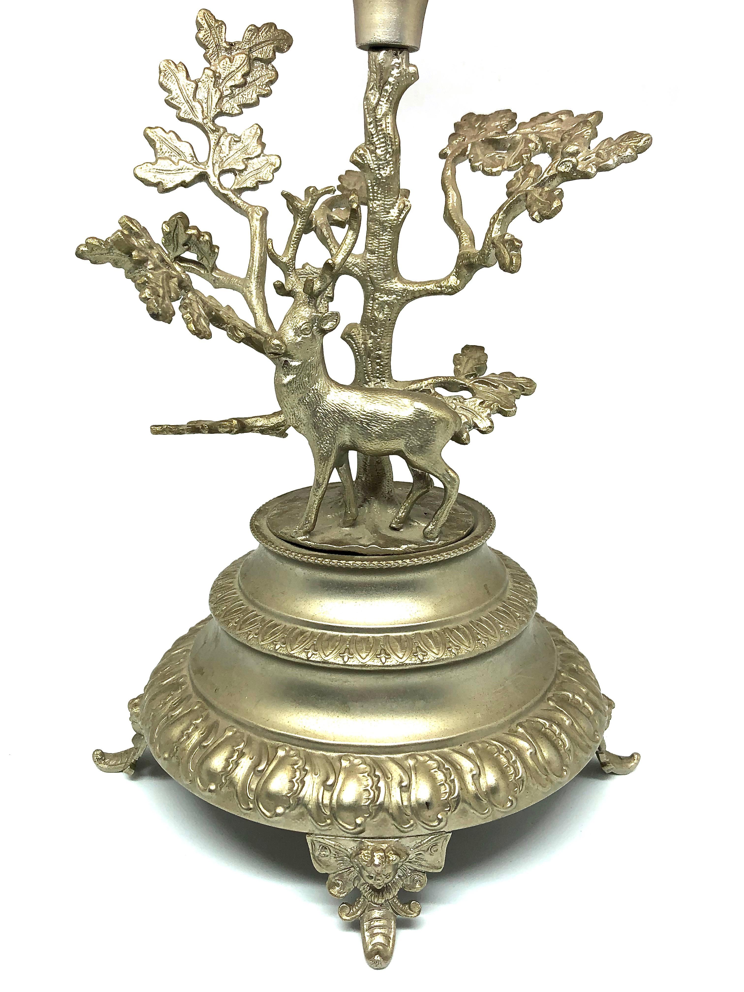An estate treasure, a gorgeous Victorian era stag deer stand with floral cranberry and clear glass compote. The glass has a ruffled edge. The stand shows a deer under an oak tree. This unique treasure is in nice pre-owned condition with no cracks or