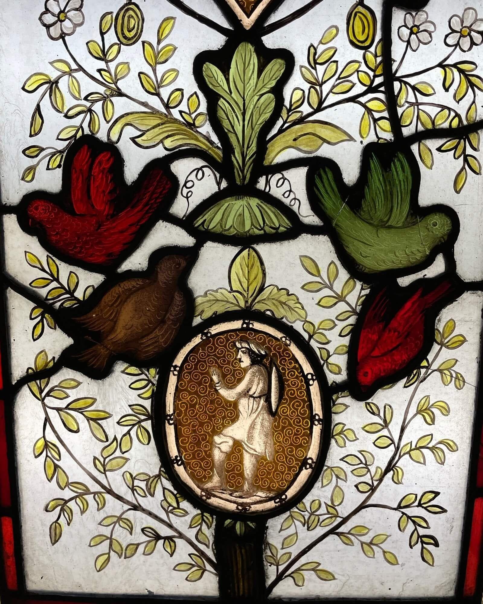 A beautiful Victorian era stained glass window depicting a tree of life style scene. We are also selling two other panels in a similar theme.

Dating to circa 1880, this antique stained glass is immersed in colour and intrigue, showcasing glass