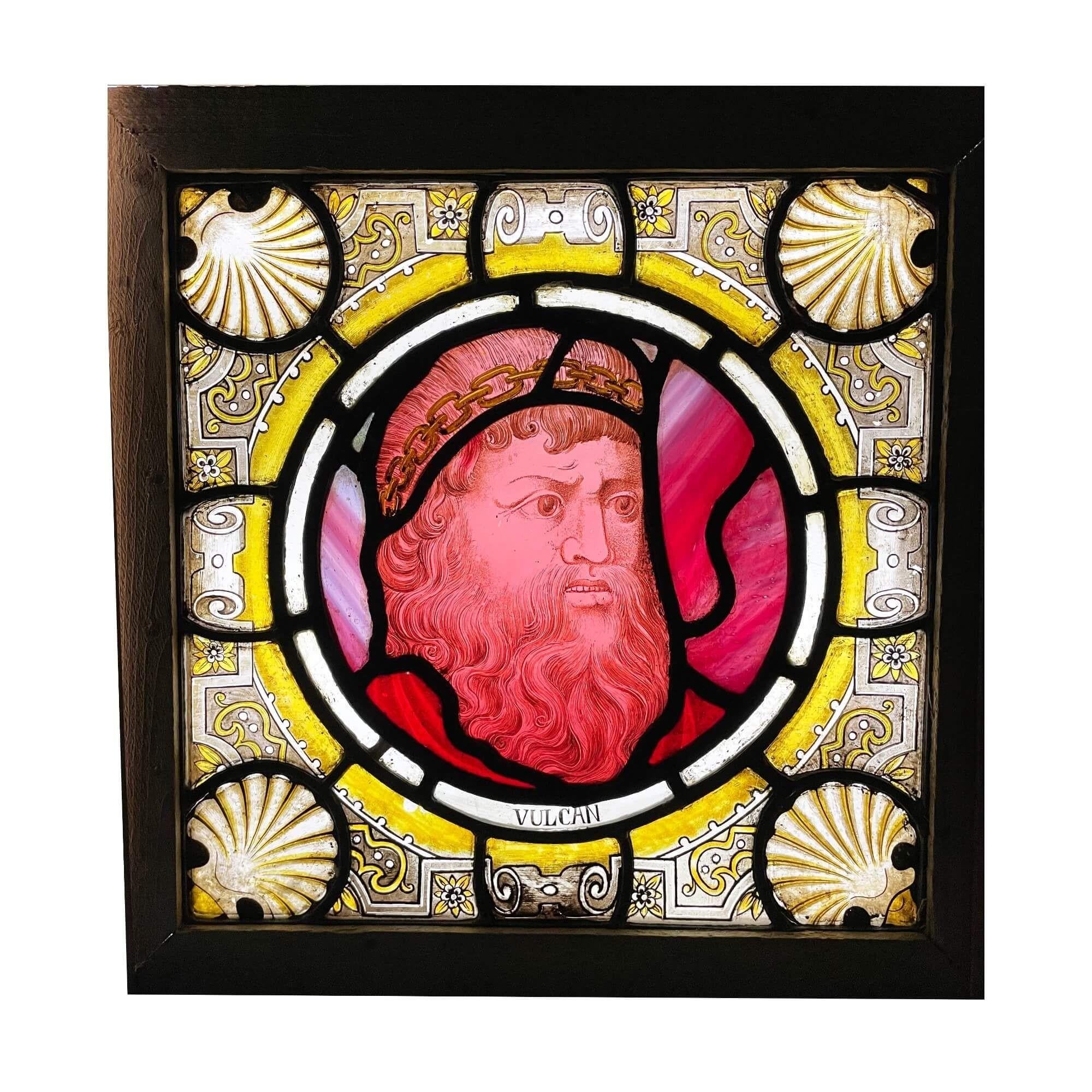 A late 19th century antique stained glass window panel depicting Vulcan, God of fire and the forge, one of 3 similar we are selling depicting notable figures of Greek and Roman mythology.

This vibrant piece was previously owned by Seymour Stein -