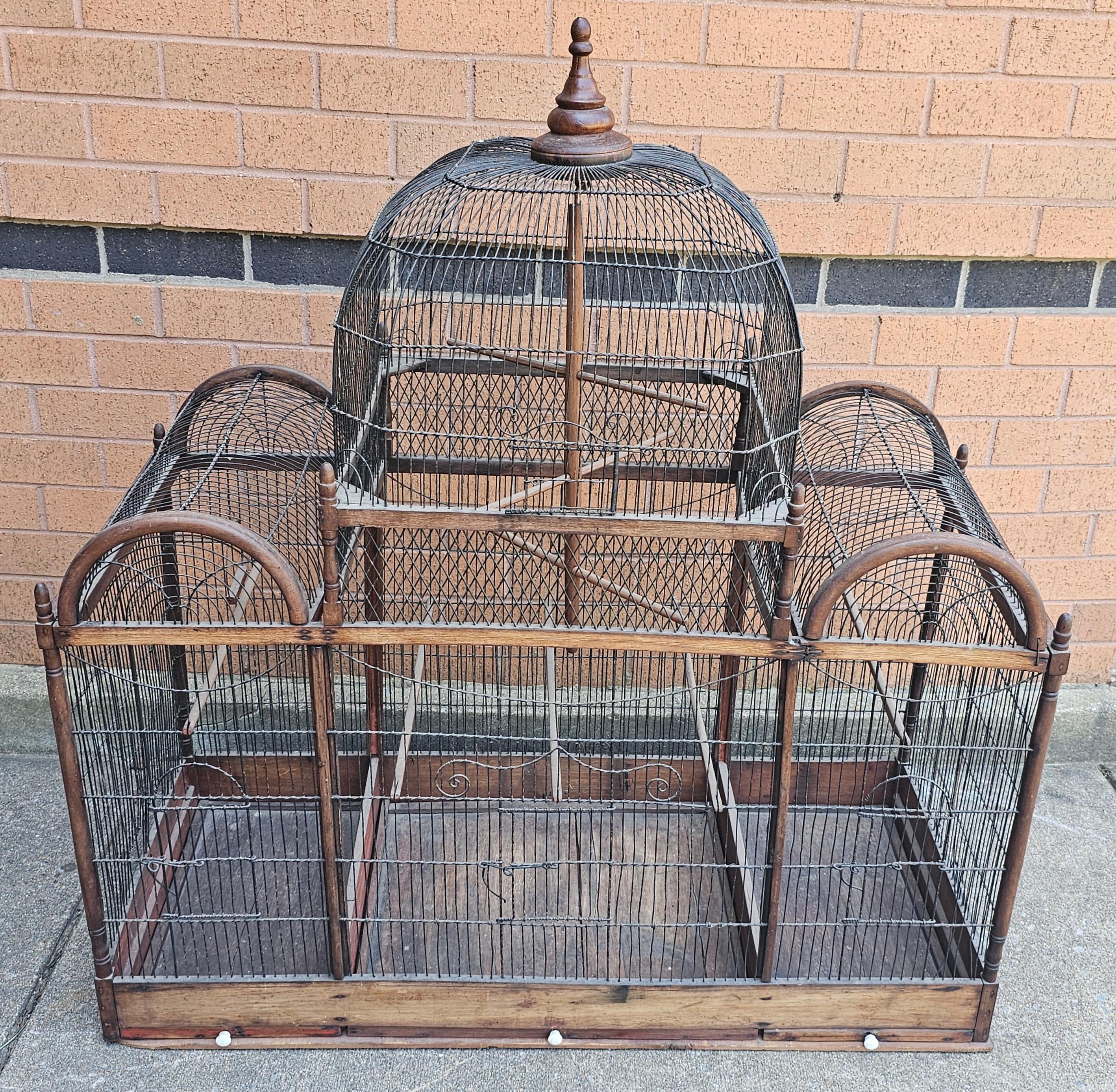A Victorian Stained Pine and Wired Metal Dome Top Bird Cage
Measures respectively from the bottom, 42