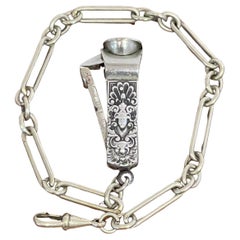 Victorian Sterling Medallion Motif Cigar Cutter with Silverplated Chain, 1890s