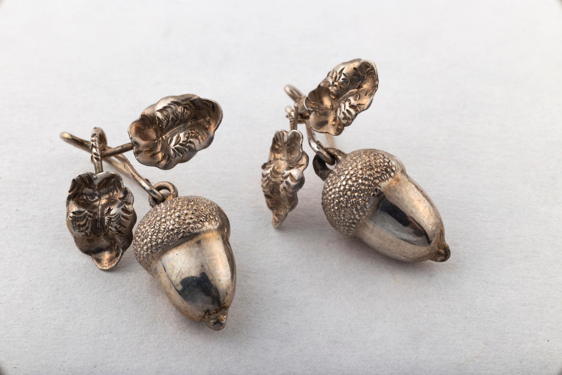 Sweet Puffy Silver light in weight Acorn earrings made in the Victorian Period. The actual earrings are bright silver, brighter than the photo. The earrings are three dimensional and the oak leaves perfectly modeled and engraved. Victorians were