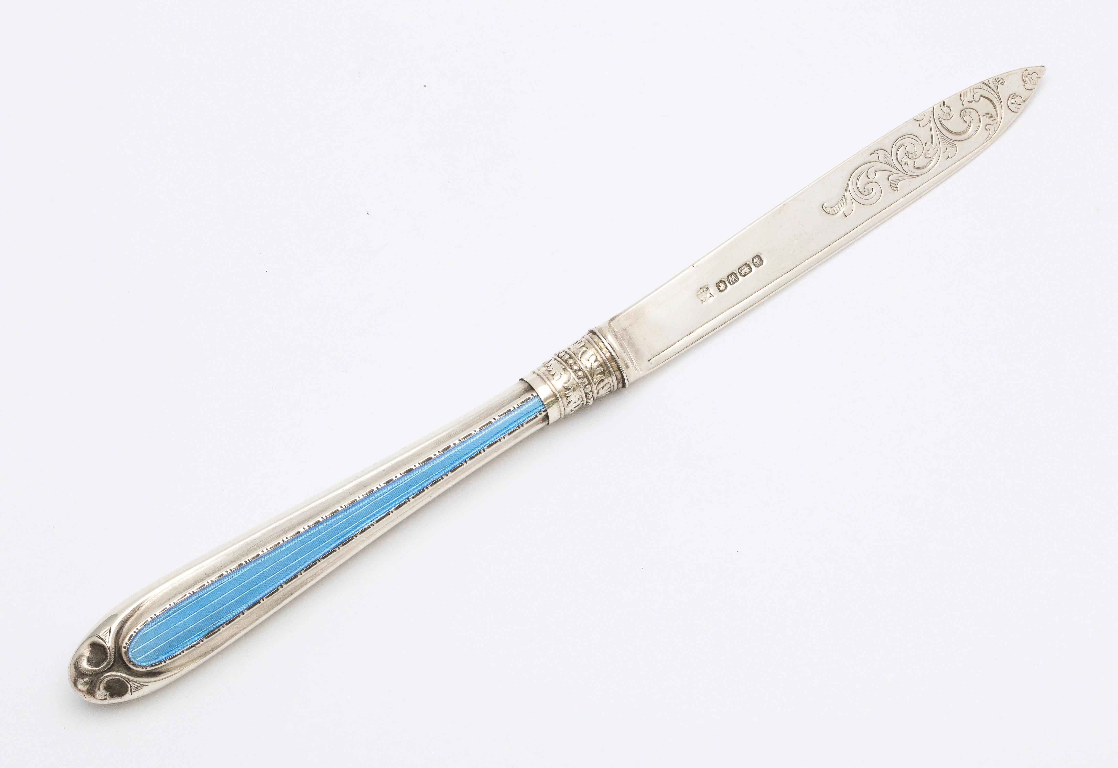 Victorian, sterling silver and blue guilloche enamel letter opener, Sheffield, England, year hallmarked for 1888, W. Gibson and J. Langman - makers. Measures 9 inches long x 3/4 inch deep x 1/2 inch high when lying flat. Enamel is on one side of the
