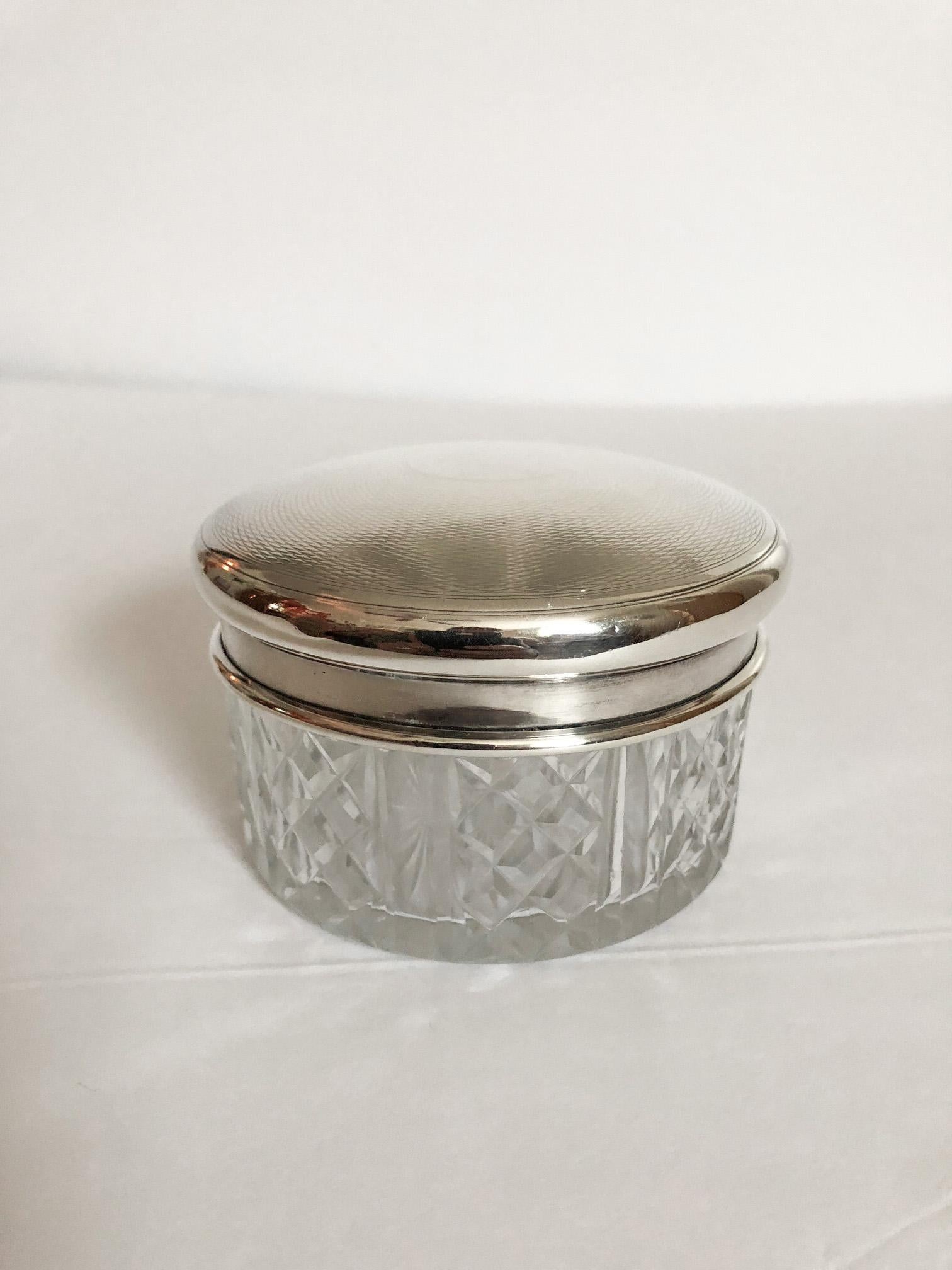 Elegant Victorian era cut glass round box with a sterling silver lid, most likely English. Marked with English sterling hallmarks.