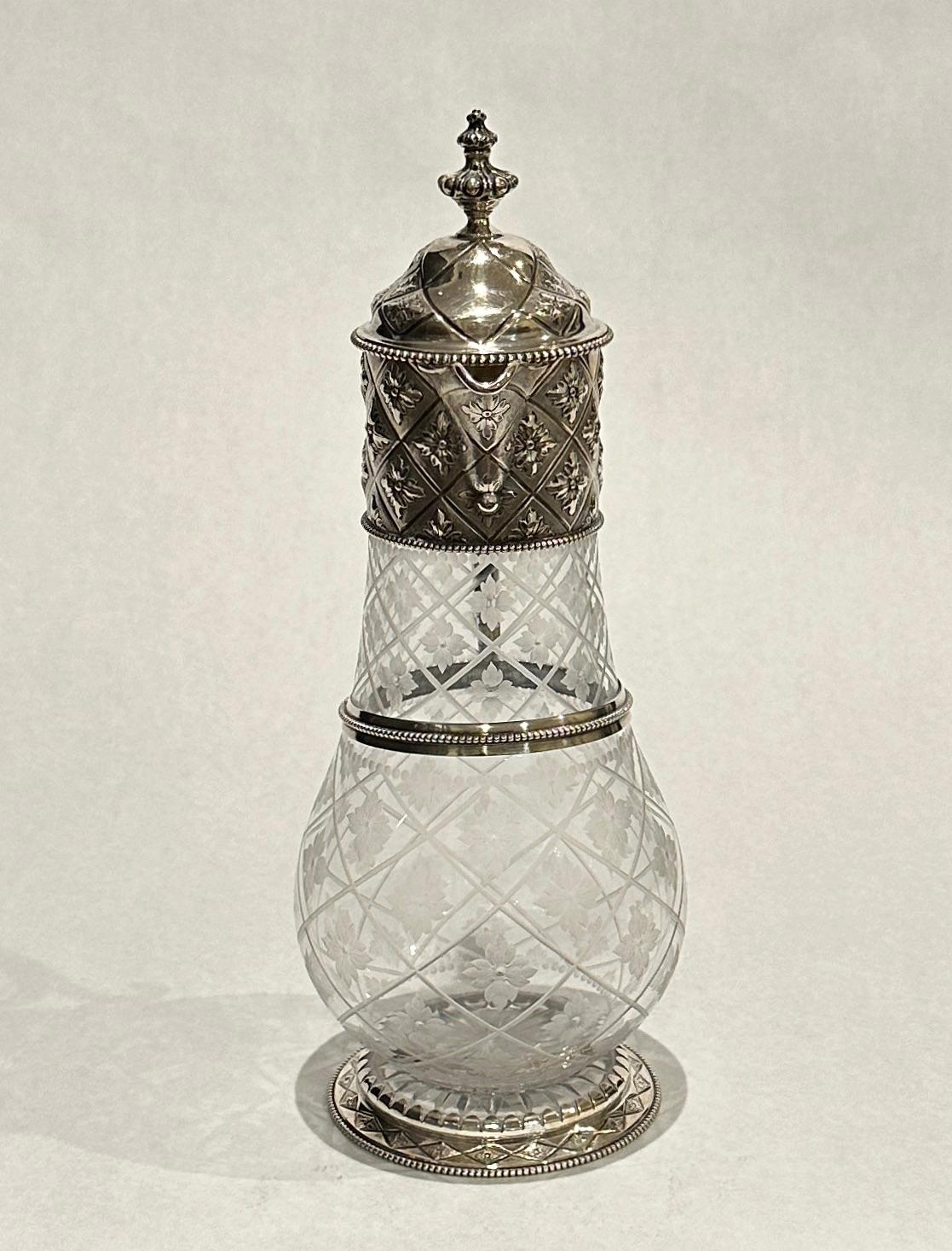 An exceptional, fine and impressive antique Victorian acid etched glass and English sterling silver mounted claret jug/wine ewer by John William Figg 1864, London. The glass body of the jug has a circular, rounded bulbous form and is embellished