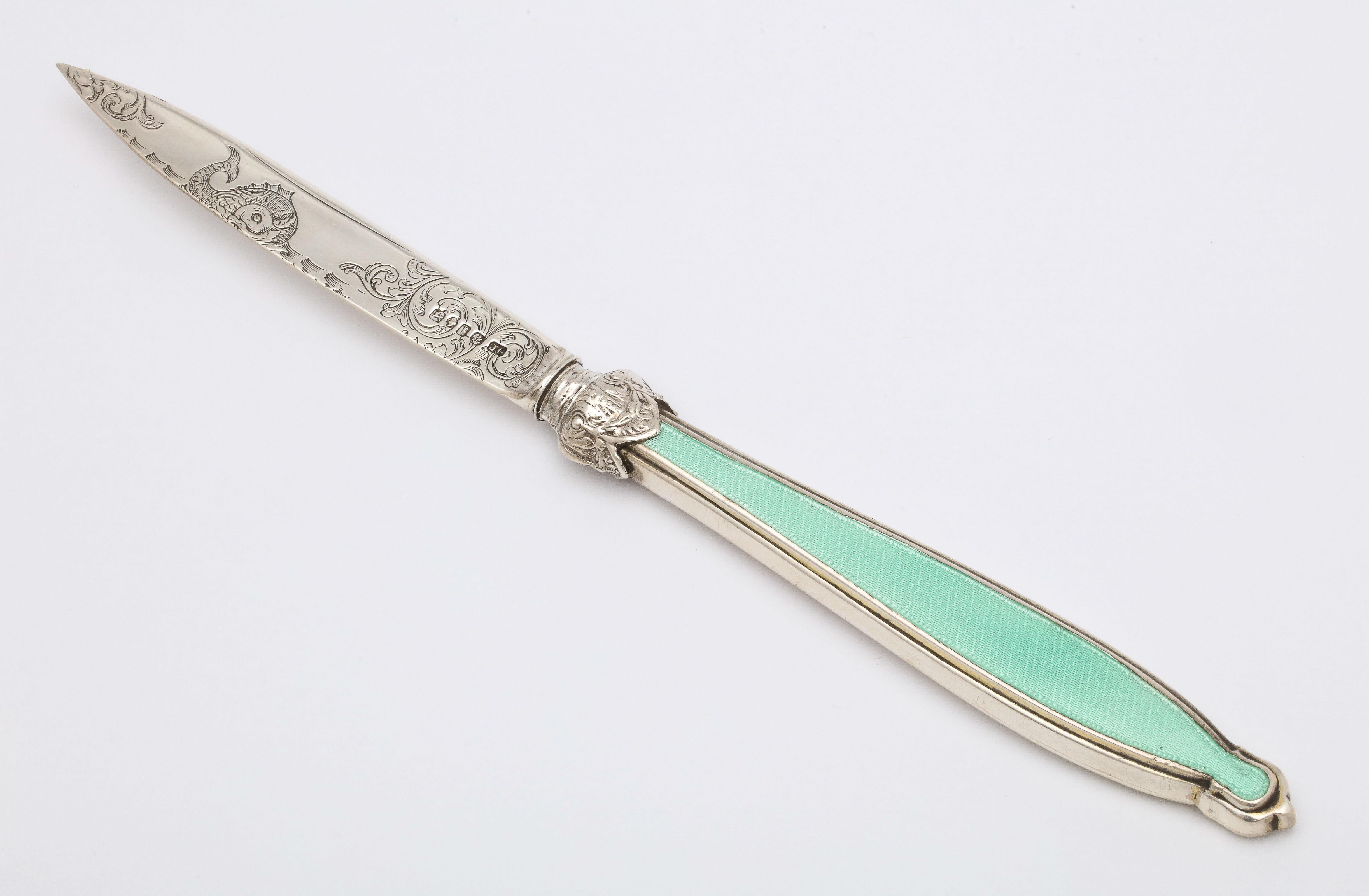 Victorian, sterling silver and mint green guilloche enamel letter opener/paper knife, Birmingham, England, 1857, Joseph Gloster - maker. Sterling silver blade is etched with swirls and a sea serpent. Measures 10 1/8 inches long x 1 inch wide (at