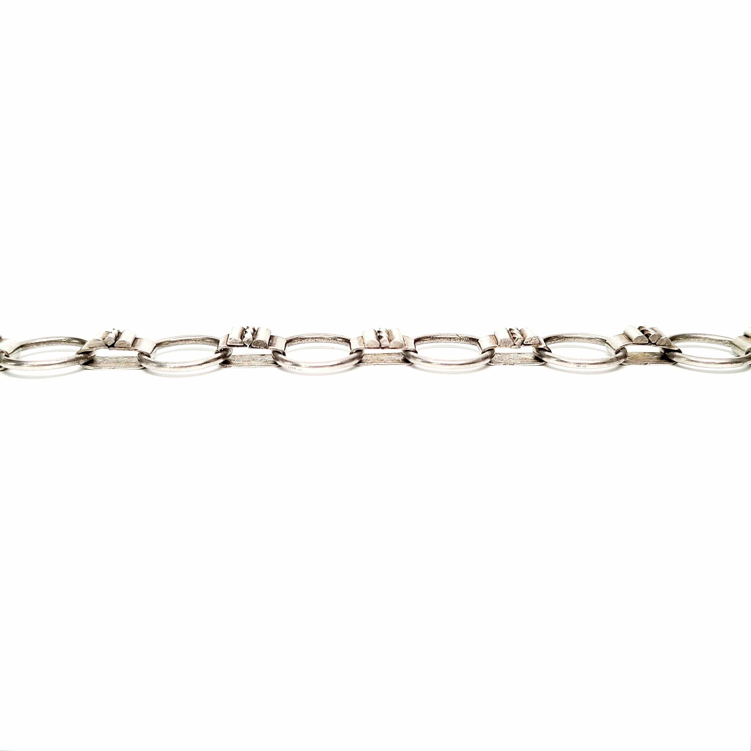 Sterling silver bookchain necklace.

Very popular during the Victorian era, this bookchain necklace features round links alternating with book links.

Chain measures approx 16