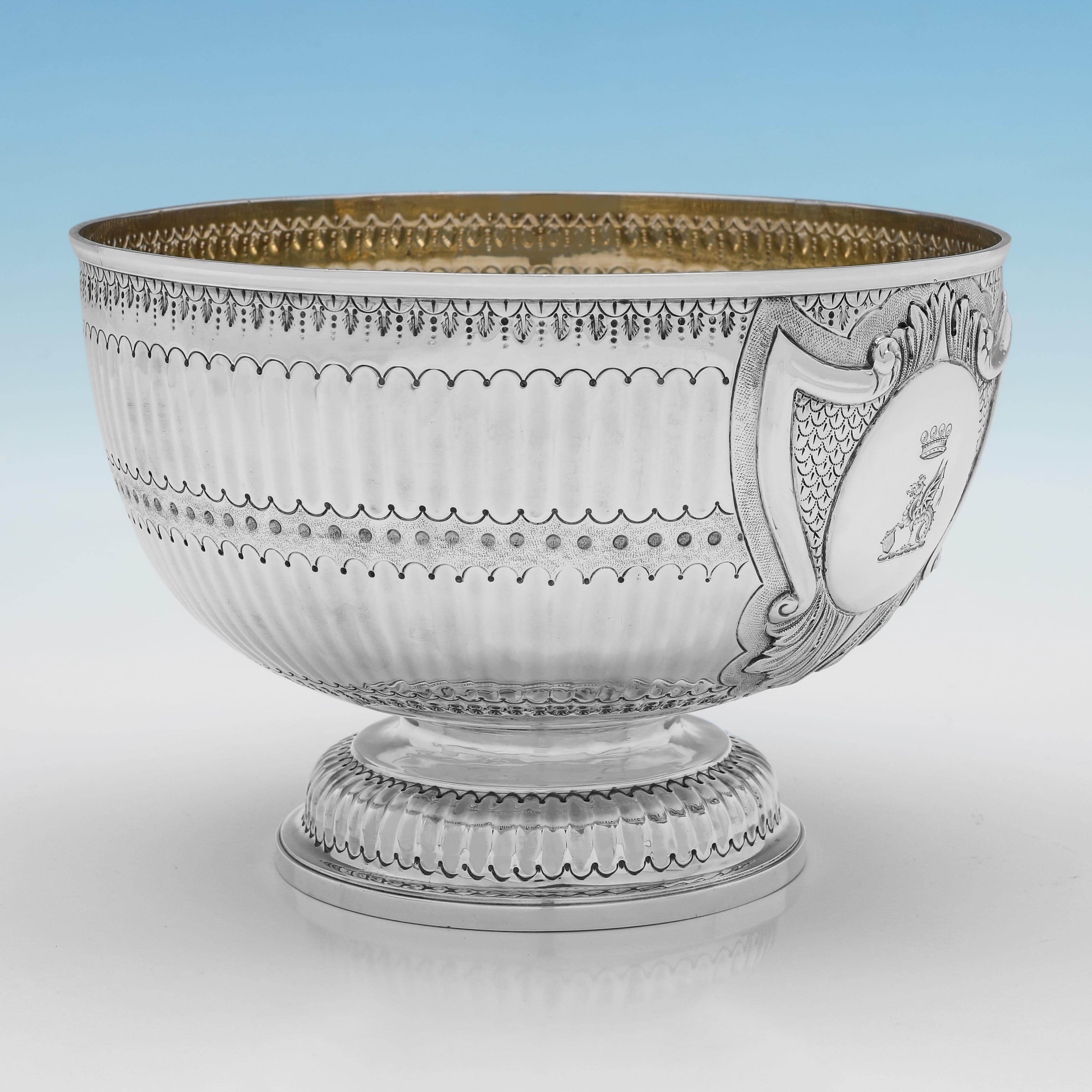 Hallmarked in London in 1888 by Charles Stuart Harris, this attractive, Antique, Victorian Sterling Silver Bowl, is ornately decorated and features a gilt interior and engraved crest to the cartouche. The bowl measures 5.75