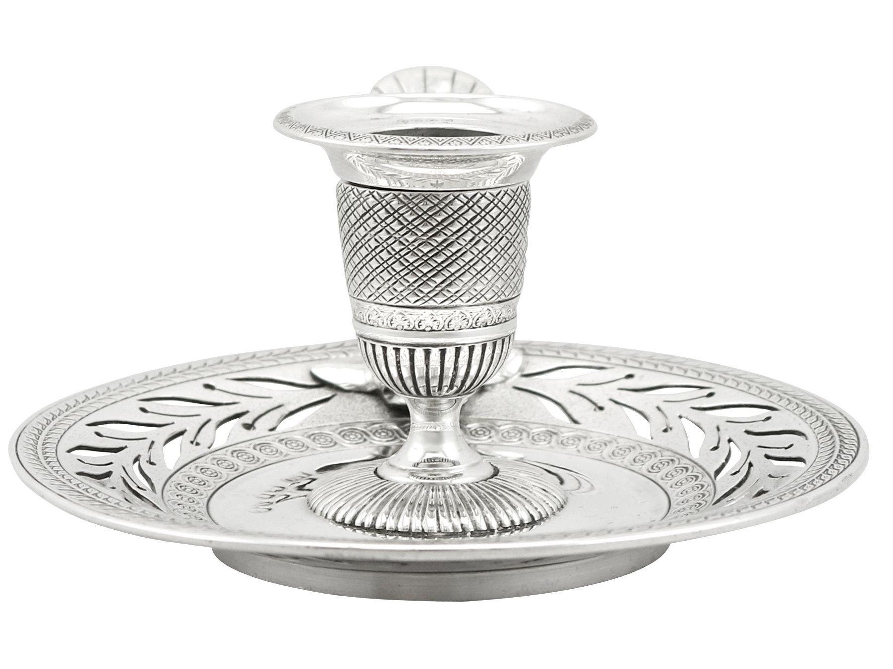 An exceptional, fine and impressive antique Victorian English sterling silver chamber candlestick; part of our range of ornamental silverware

This exceptional antique Victorian sterling silver chamberstick has a circular rounded form.

The cast