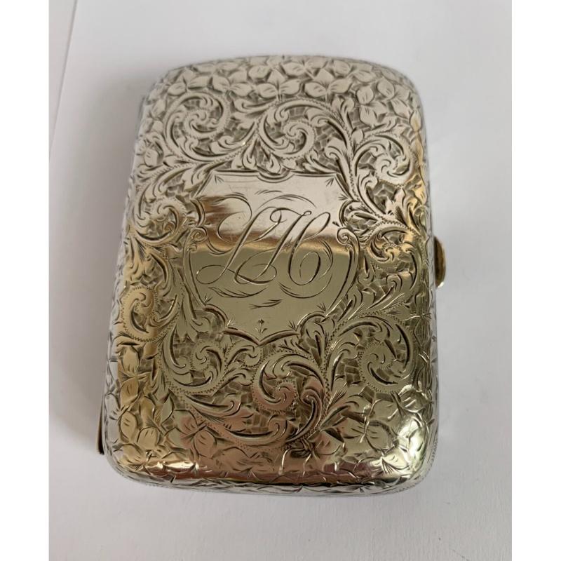 In good vintage condition.  
This lovely cigarette case is made in a heavy gauge sterling silver. It has a lovely curved shape.
A lovely foliate acanthus engraved decoration gives it a rich elegant feel.
Hallmarked: Made by E V Pledge & Son in