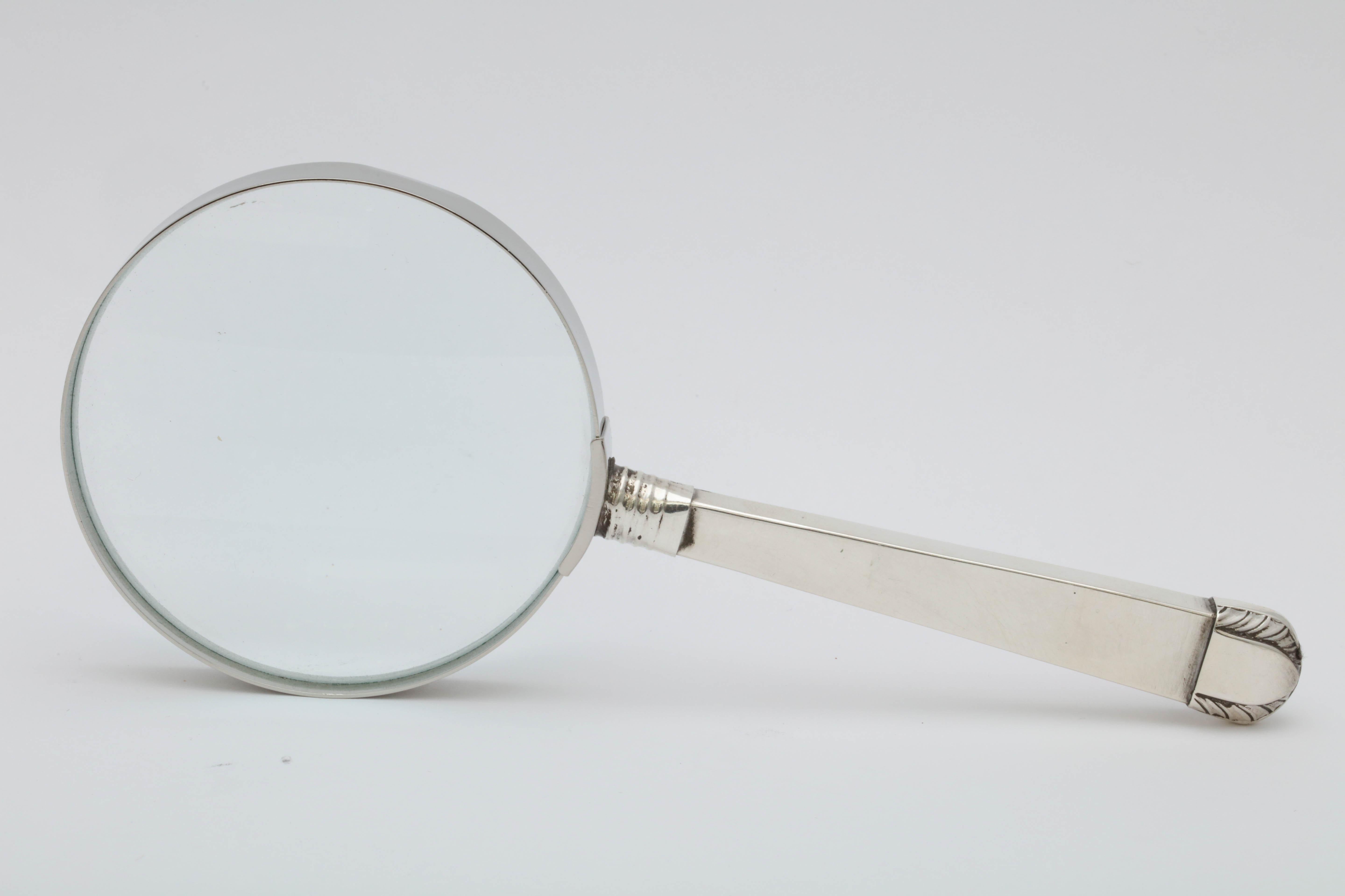 Victorian, sterling silver and deep pink guilloche enamel-mounted magnifying glass, Sheffield, England, 1895, Martin & Hall makers. Pink guilloche enamel is on one side of the handle. Glass itself has metal surround for strength. Measures 7 inches