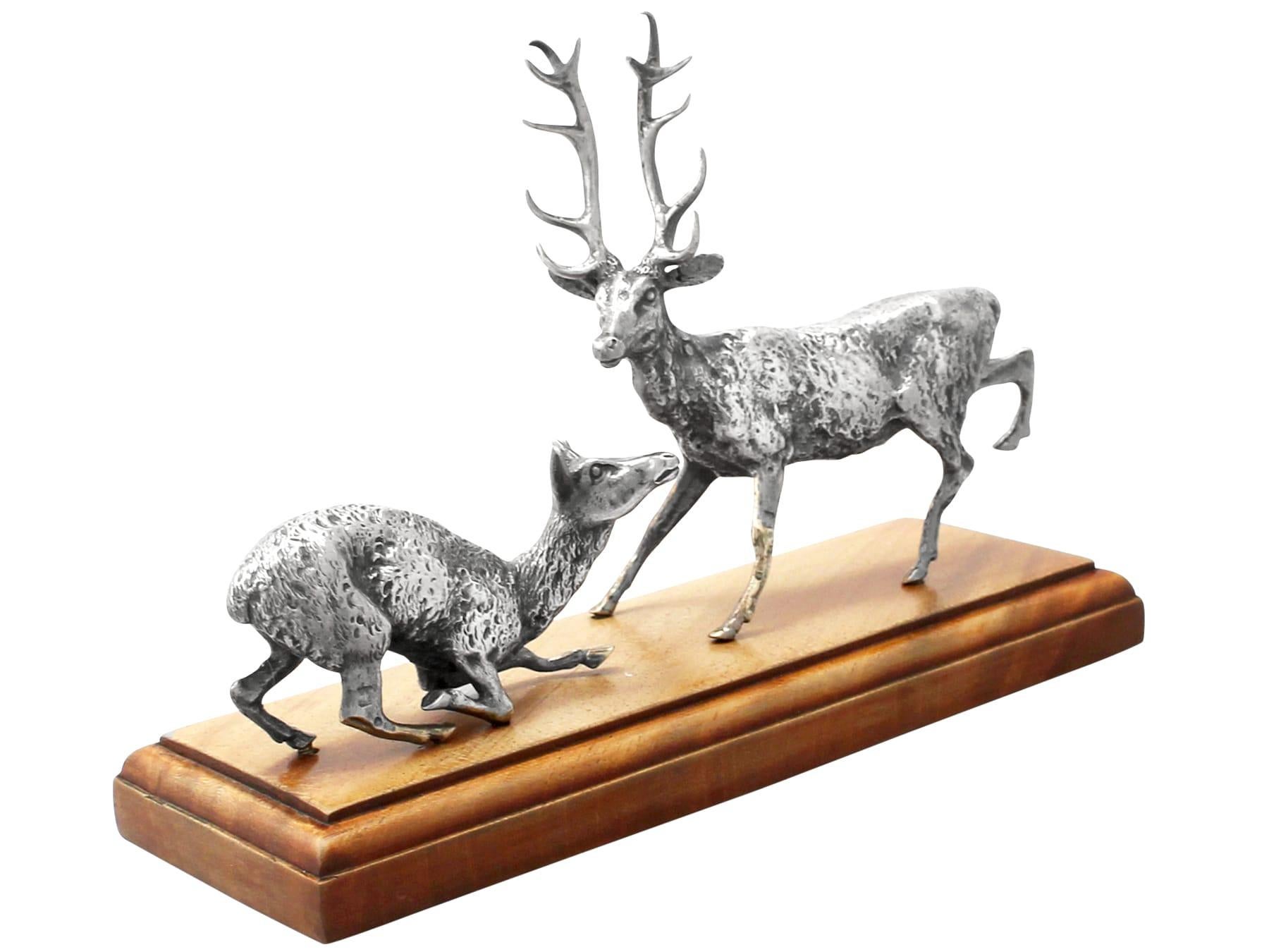 A fine and impressive antique pair of Victorian English cast sterling silver deer and stag models on a plinth; an addition to our animal related silverware collection.

These fine antique Victorian cast sterling silver table ornament is