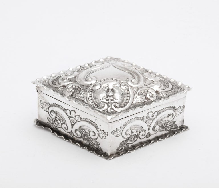 Victorian, sterling silver, diamond-form trinkets box with hinged lid, Birmingham, England, year-hallmarked for 1897, Deakin and Francis - makers. Gilt interior. Measures 3 1/4 inches wide x 2 1/2 inches deep x 1 1/2 inches high. Weighs 1.595 Troy