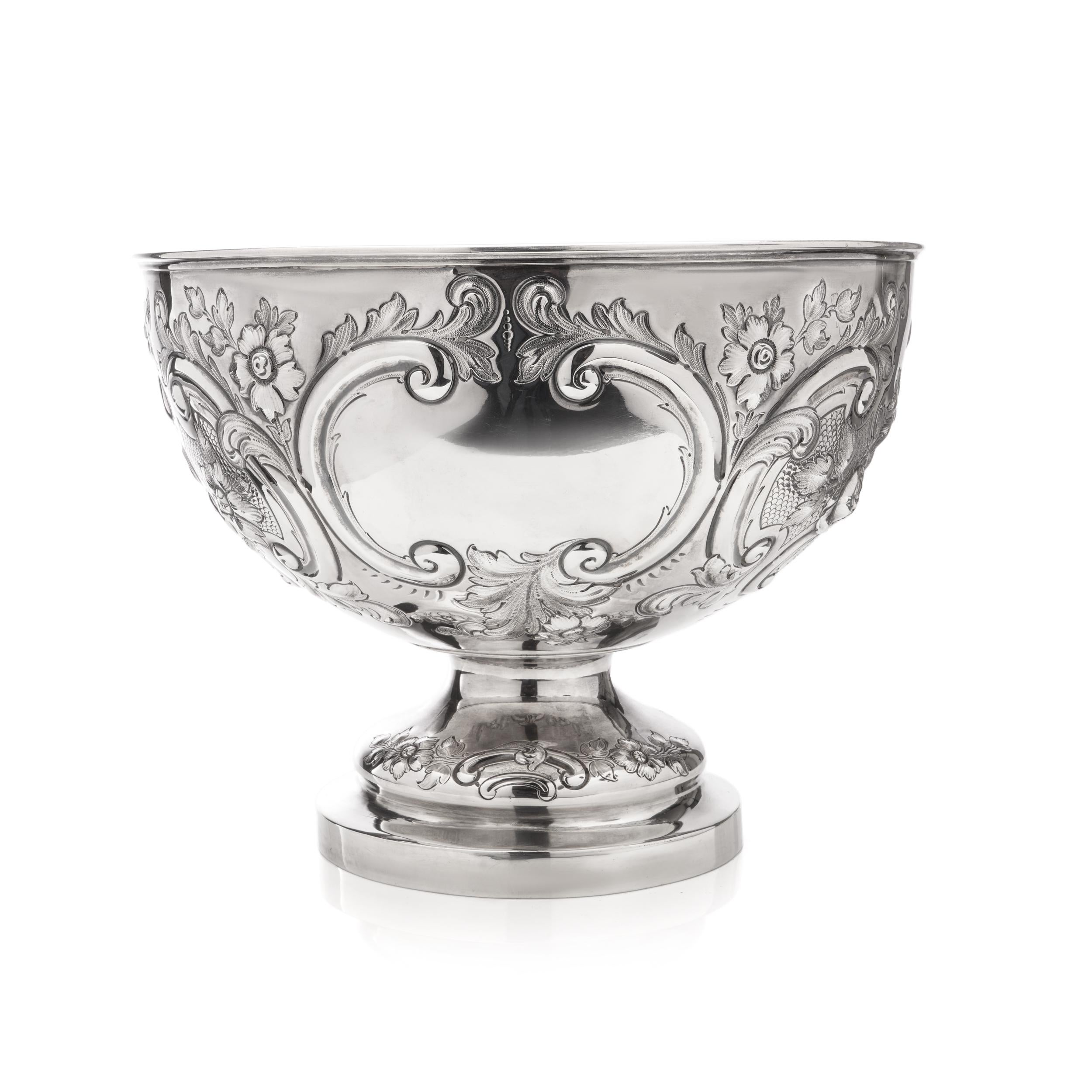 Antique Victorian sterling 925 silver embossed large punch bowl/wine cooler. 
Cooler is embossed with scrolls, acanthus leaves and floral motifs.

Please note: cooler has a commemorative inscription ' Presented to Miss J.Hanbury Williams By Crawshay