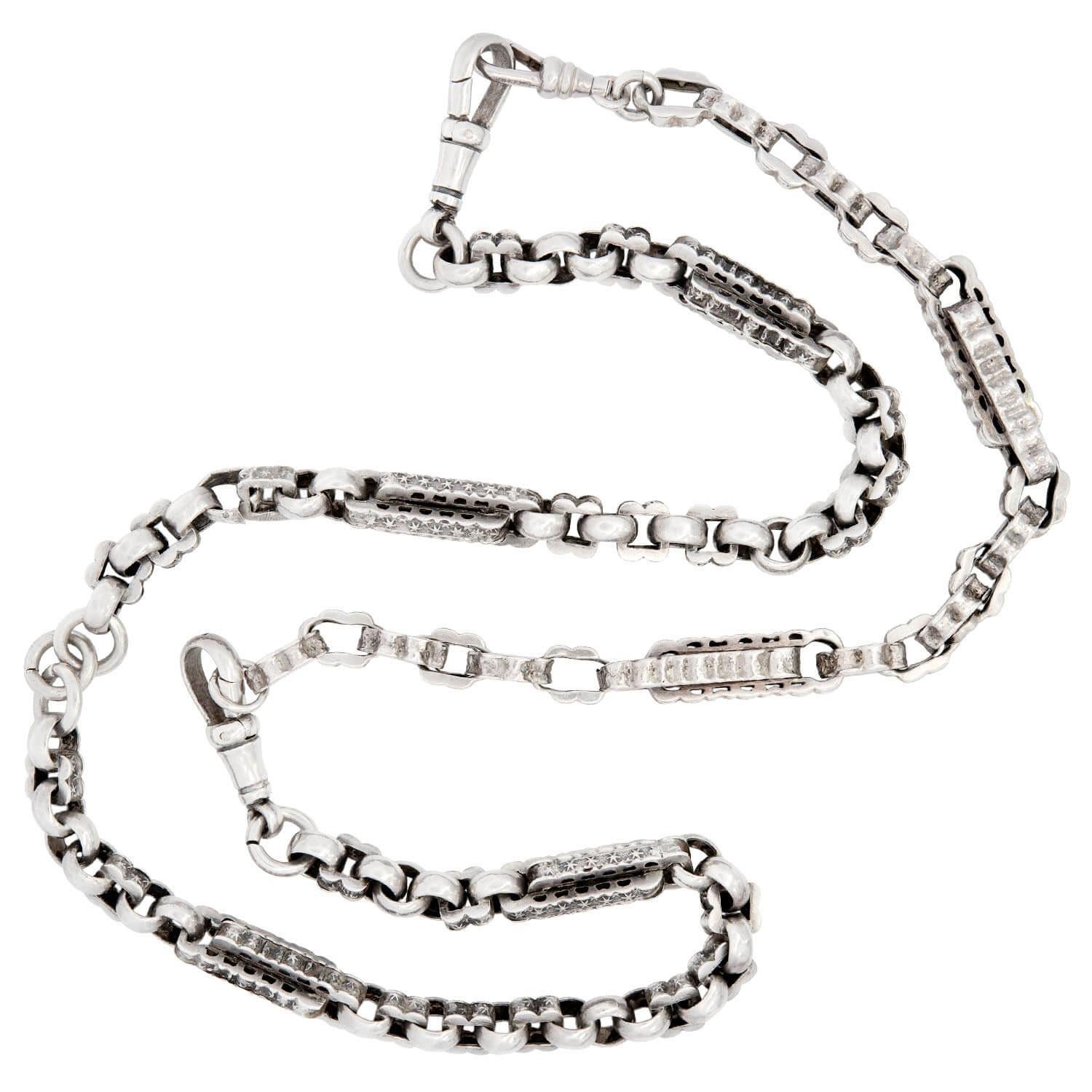 A fabulous Etruscan-style necklace and bracelet set from the Victorian (ca1880s) era! This stunning chain is crafted in sterling silver, and features six cylindrical links, which are Etruscan in style. The remainder of the chain is composed of