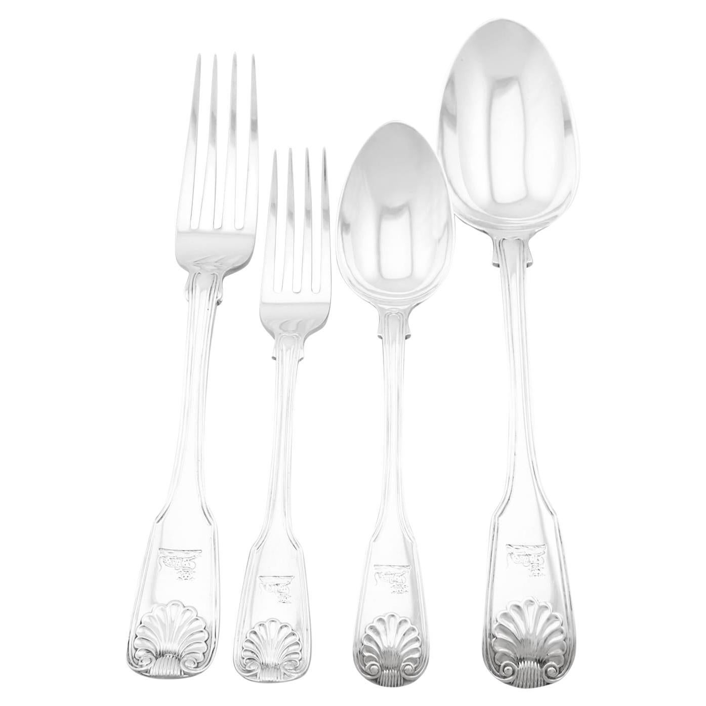 Victorian Sterling Silver Flatware Set for Twelve Persons by George Adams (1842) For Sale