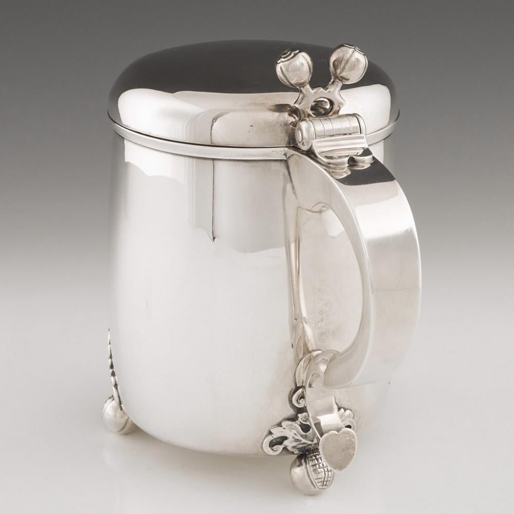 Victorian Sterling Silver Lidded Yard Tankard London, 1870

This fine tankard has a capacity of a yard of ale , two and a half pints. Most people are familiar with yard glasses, but a yard is a measure of volume. This is not a peg tankard, it does