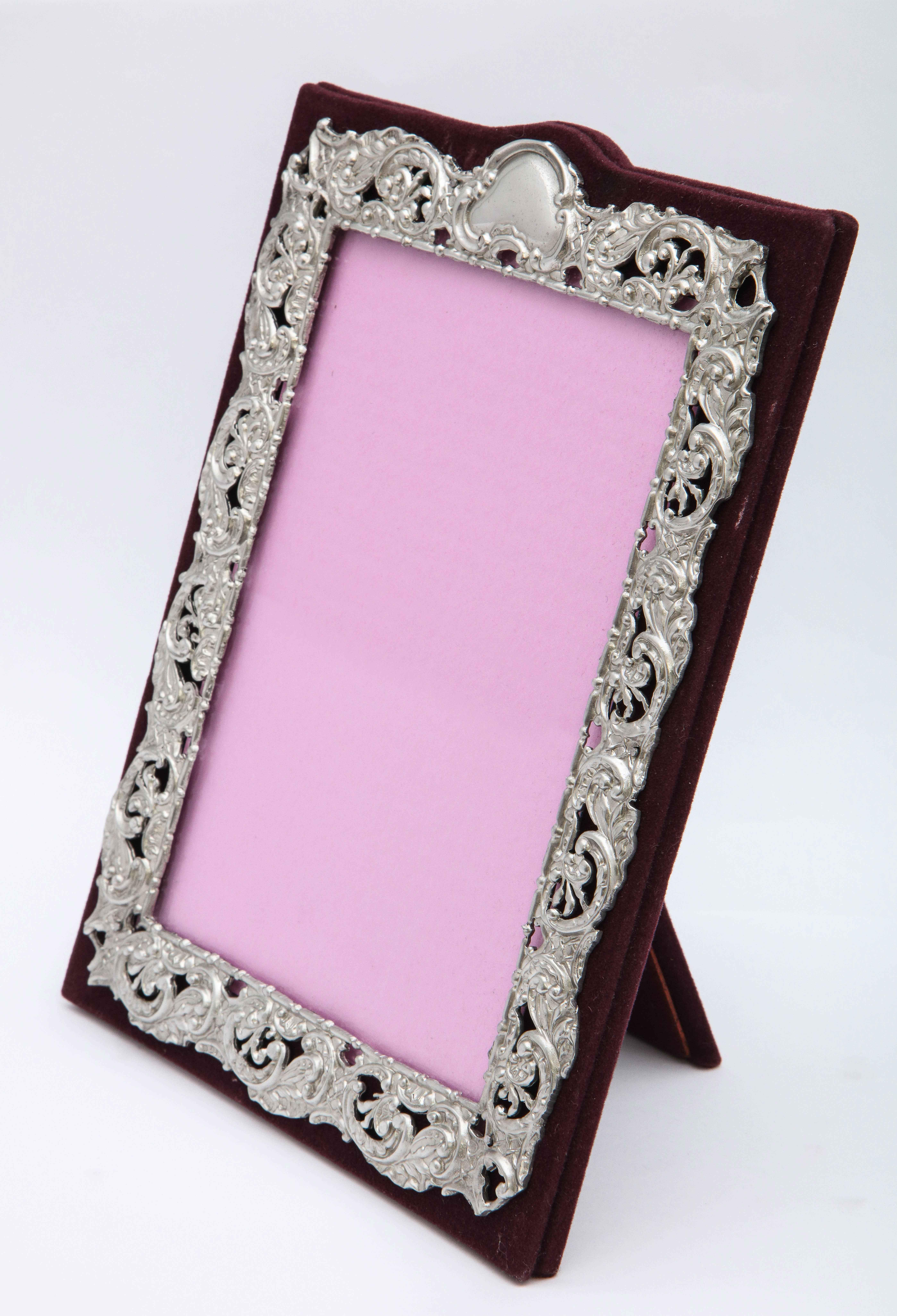 Victorian, sterling silver -mounted (on burgundy velvet) picture frame, Birmingham, England, year-hallmarked for 1898, Deakin and Francis - makers. Sterling silver has a matte finish, and is pierced so that the burgundy velvet shows through. Frame