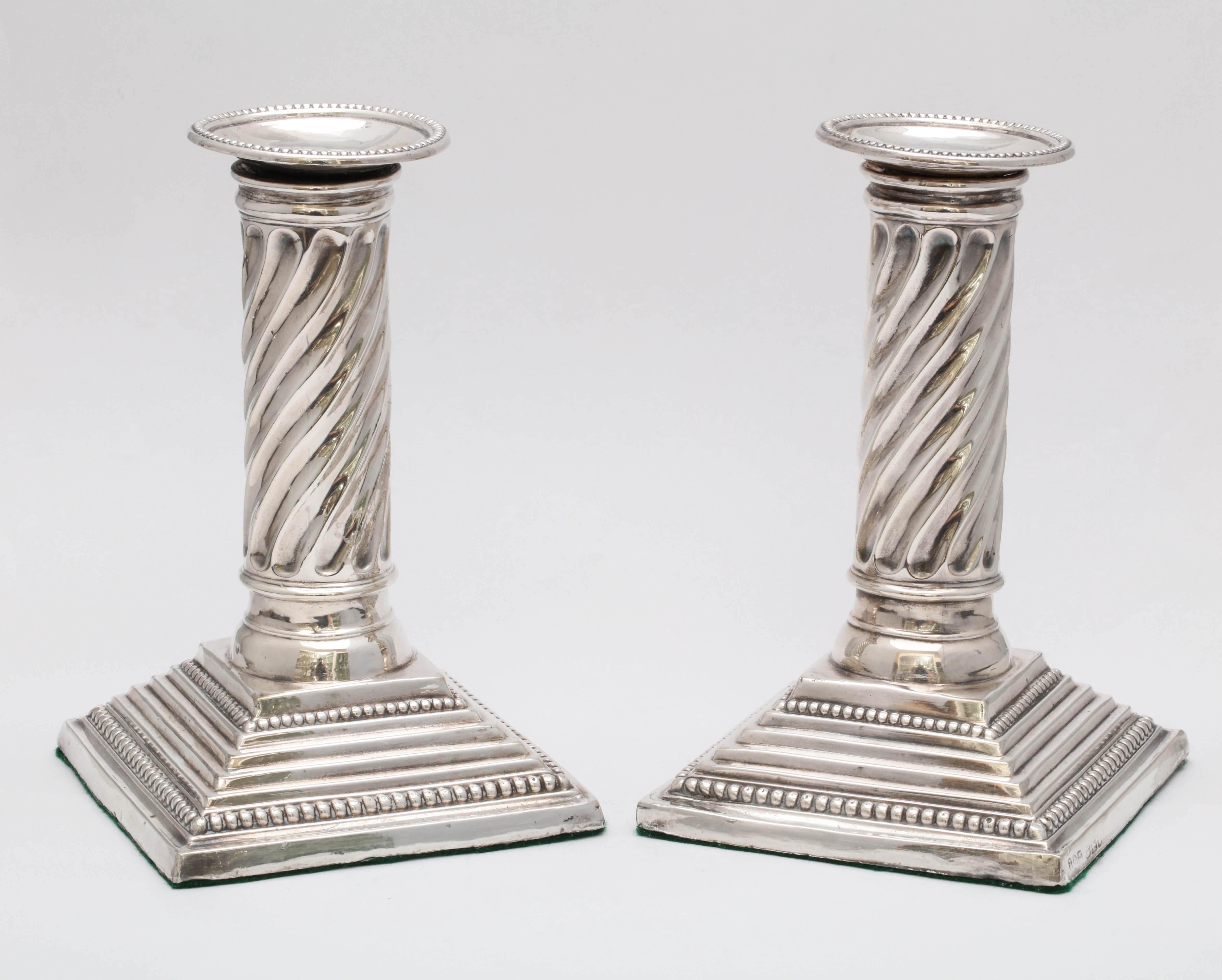 Unusual, Victorian, sterling silver, neoclassical style, spiral column-form candlesticks, Sheffield, England, 1898, Jenkins and Timm - makers. Weighted. 6 1/2 inches high x 3 1/2 inches deep (at deepest point) x 3 1/2 inches wide (at widest point.