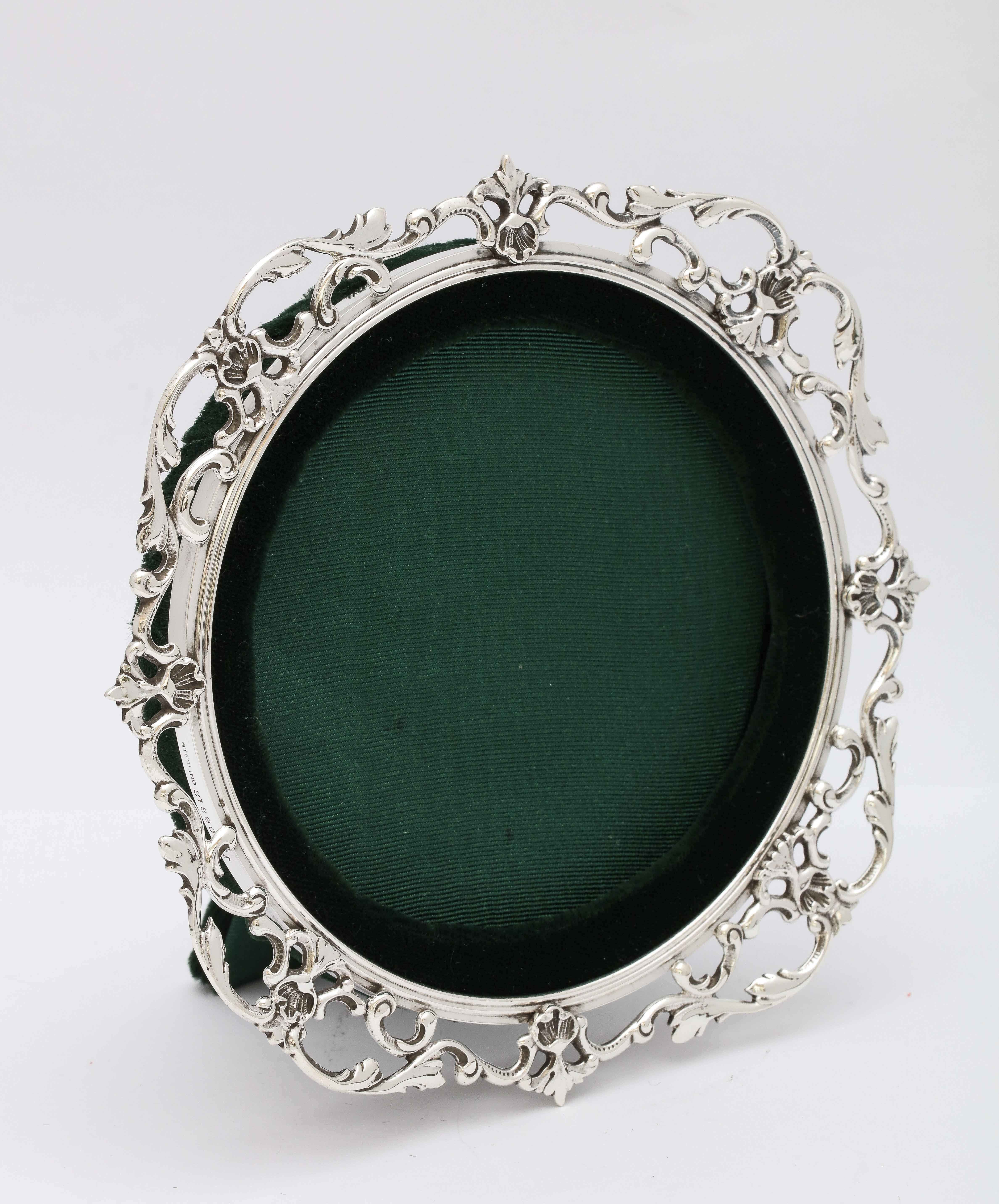 Victorian, sterling silver picture frame, Gorham Mfg. Co., Providence, Rhode Island, year-hallmarked for 1894. Measures 6 inches high x 6 inches wide; when easel is in open position, frame measures 3 1/2 inches deep. Frame will hold a photo 4 inches
