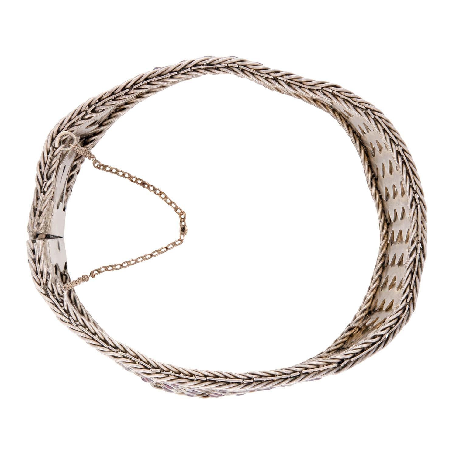 A fabulous woven bracelet from the Victorian (ca1880s) era! Crafted in sterling silver, this unique bracelet features a fantastic woven-design. Therefore, the piece is flexible and has great movement. The entire surface of the piece is encrusted