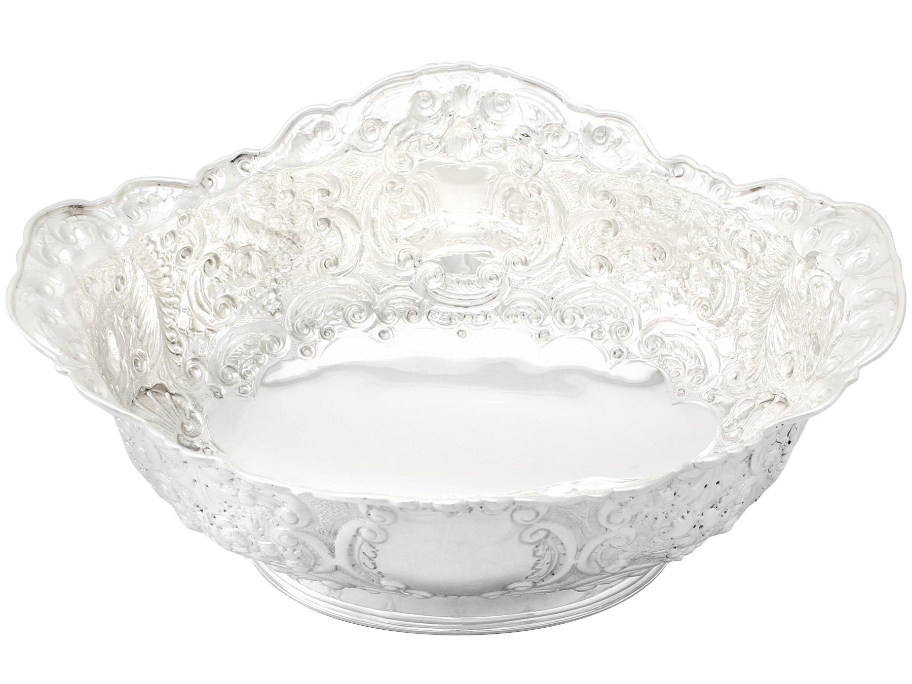A fine antique Victorian sterling silver presentation bowl; part of our presentation silverware collection

This fine antique sterling silver bowl has an oval spreading form onto a plain oval foot.

The body of this Victorian bowl is embellished