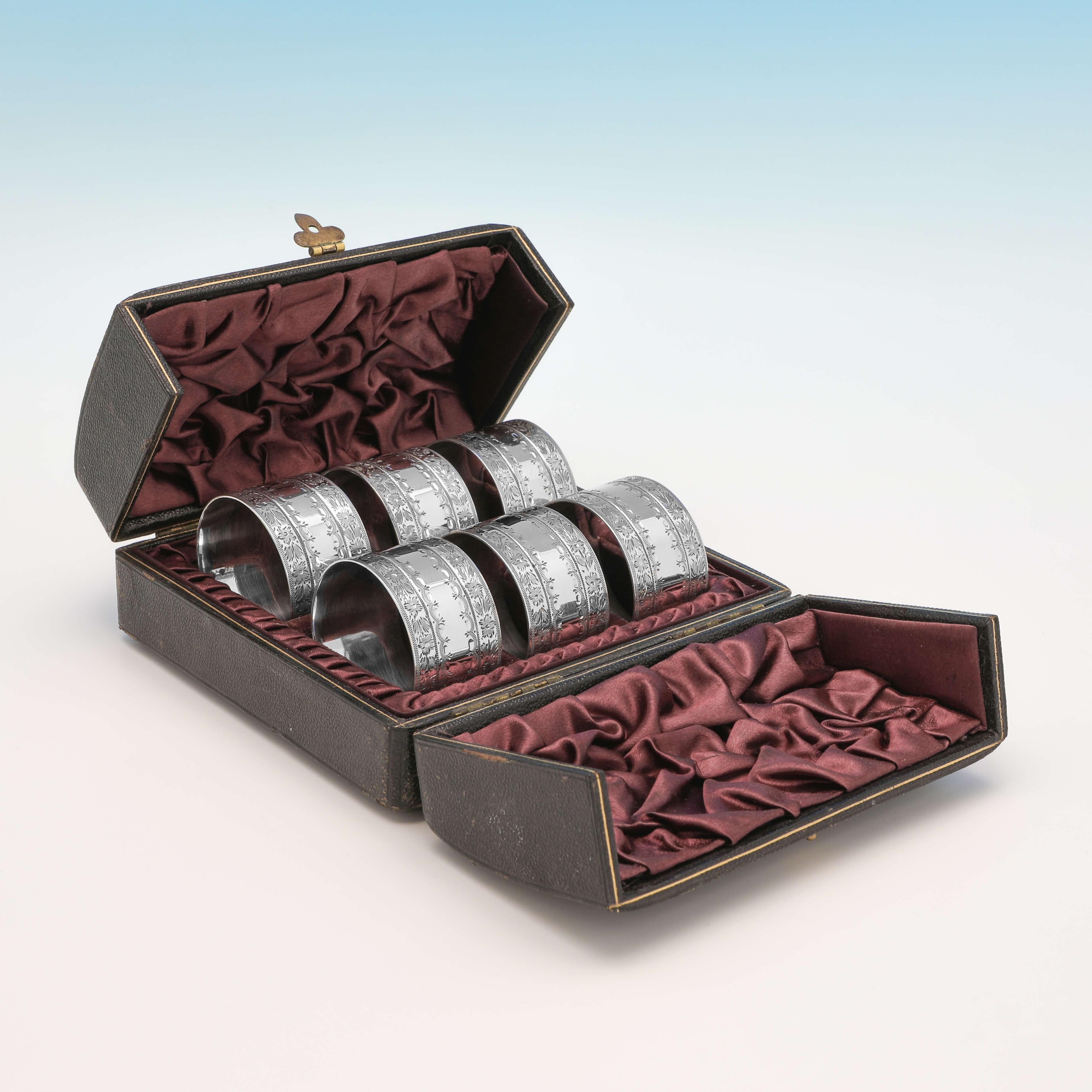 Hallmarked in Sheffield in 1891 by Martin, Hall & Co., this very attractive set of 6 Antique sterling silver napkin rings, feature engraved bands of decoration to each, and are presented in their original box. 

Each napkin ring measures 1