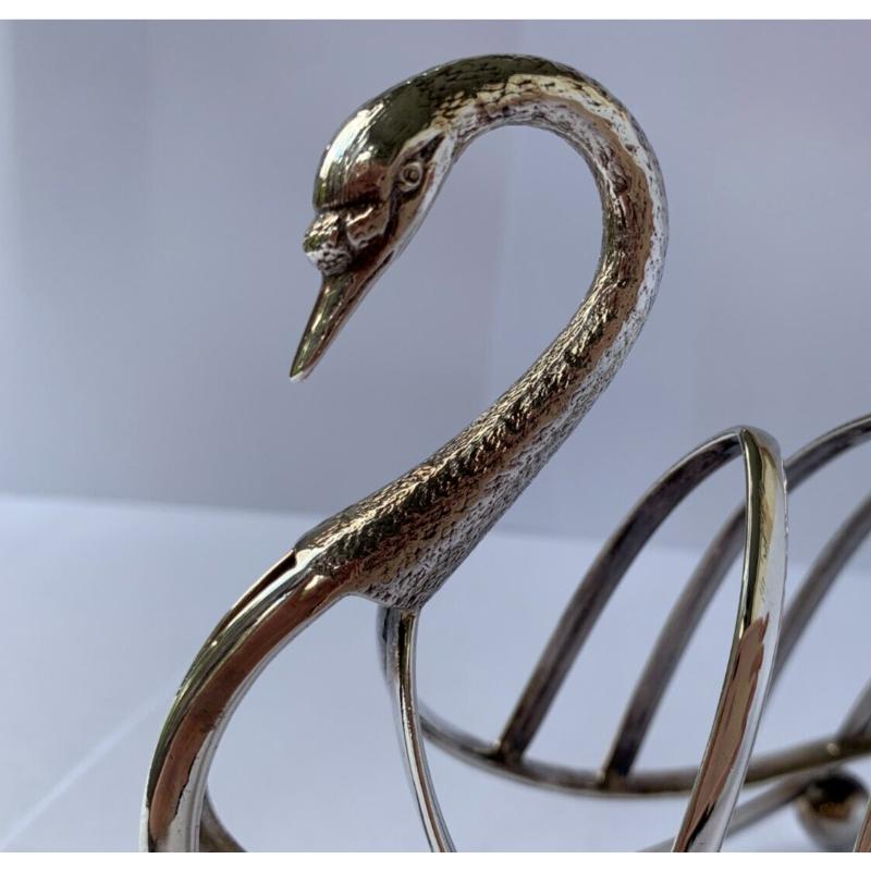 In good vintage condition, the swan has a beautifully engraved neck. The four-division toast rack is in the form of a swan, resting on four ball feet.

Hallmarked: Made by Levesley Brothers (Thomas Levesley) in Central Works, Mary Street, Sheffield