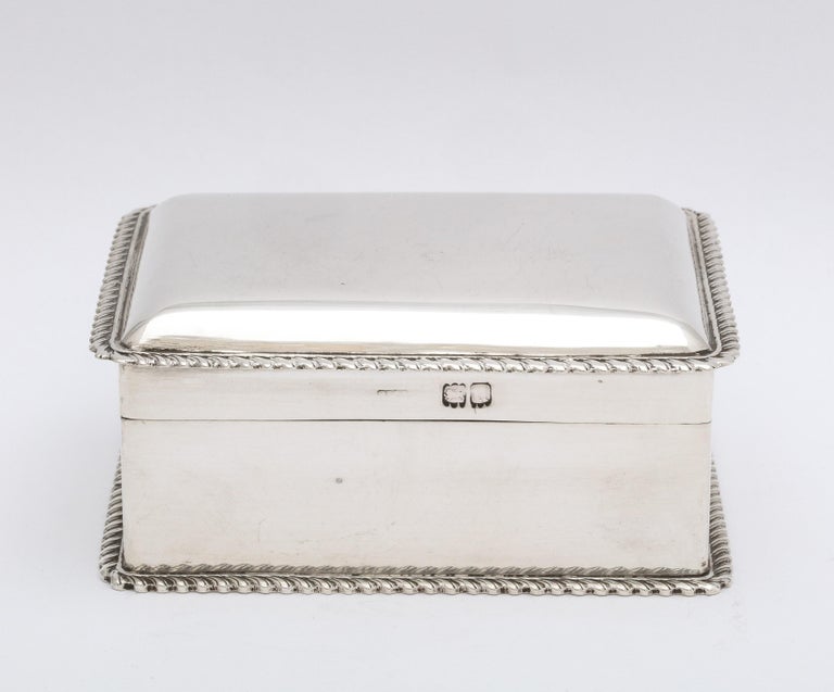 Victorian, sterling silver table/trinkets box with hinged lid, London, year hallmarked for 1899, Stokes and Ireland, Ltd. - makers. Gilded interior. All edges are reeded in design. Measures 4 inches wide x 3 inches deep x 2 inches high, Weighs 6.320