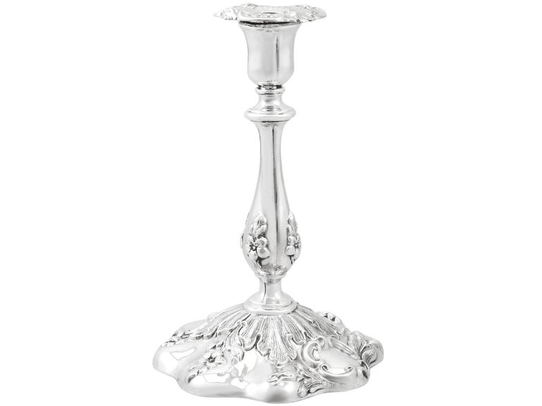 An exceptional, fine and impressive antique Victorian English sterling silver taperstick; an addition of our ornamental silverware collection.

This exceptional antique Victorian sterling silver taperstick has a baluster shaped form.

The