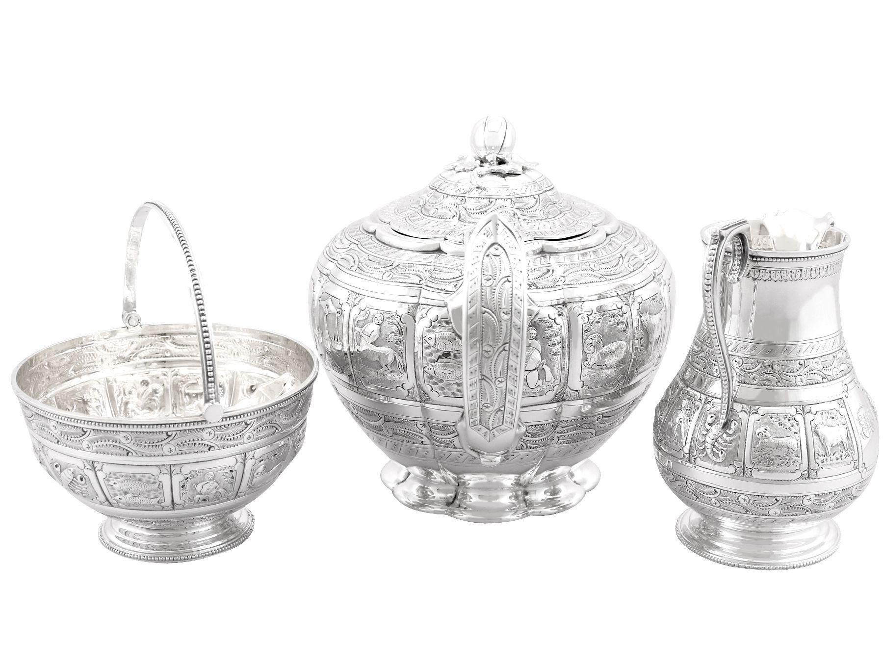 An exceptional, fine and impressive antique Victorian English sterling silver three piece tea service, with Zodiac influence; part of our silver teaware collection
This exceptional antique Victorian silver tea set, in sterling standard, consists of
