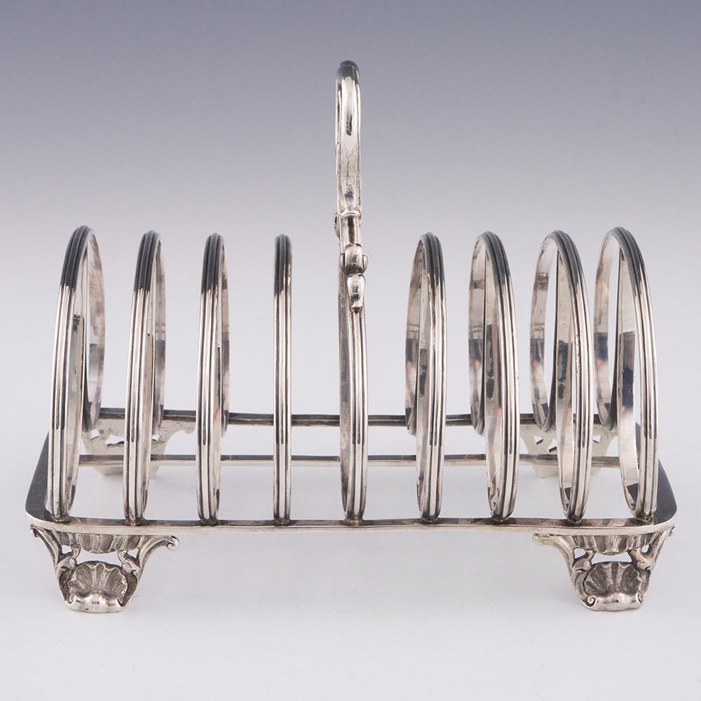 

Heading : Victorian sterling silver toast rack retailed by Makepeace
Date : Hallmarked in London in 1840 for Richard Sibley II – retail stamp for Makepeace, London
Period : Victoria
Origin : London, England
Decoration : Reeded double loop eight