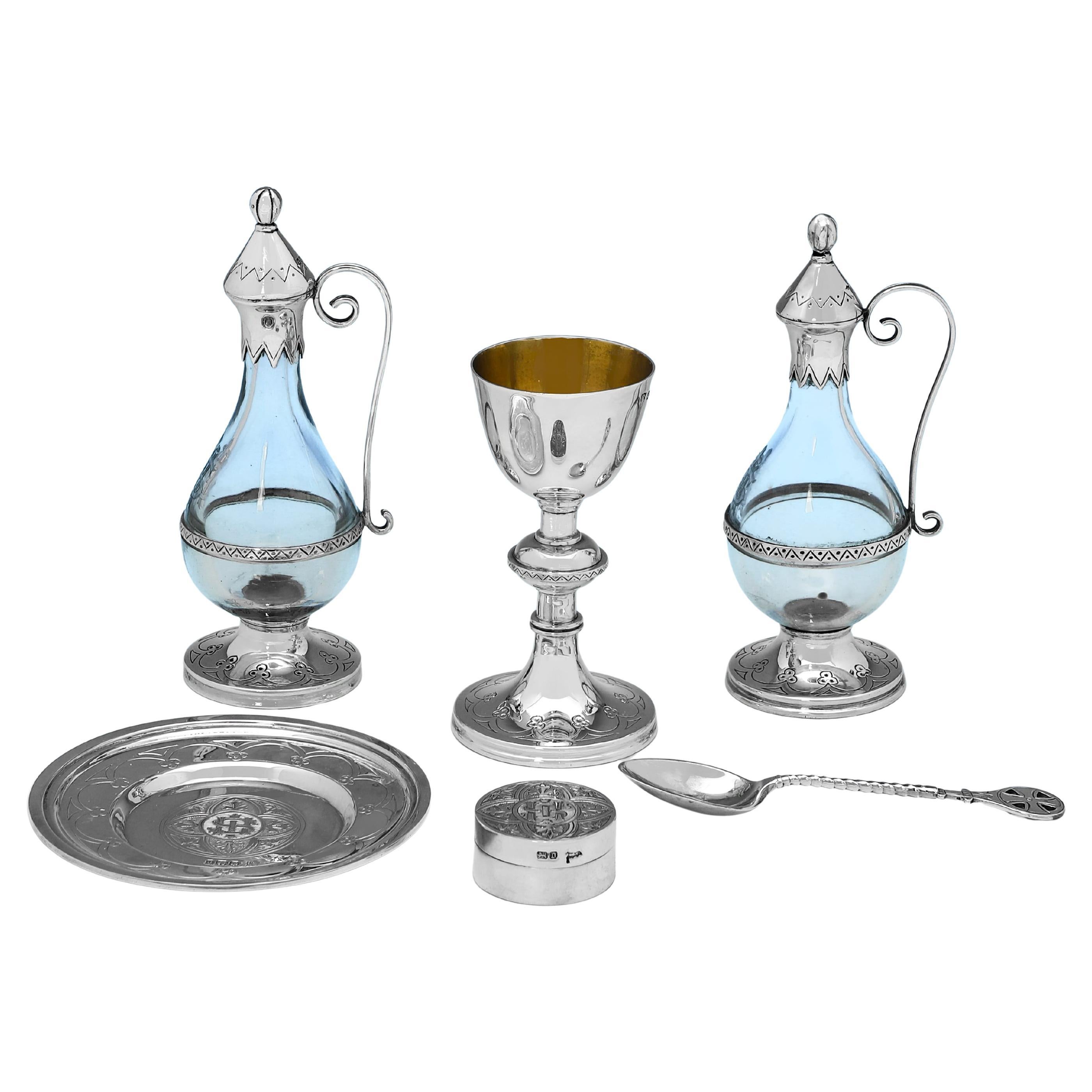 Hallmarked in Sheffield in 1894 by Henry Wilkinson, with pieces also made by Walker & Hall, this handsome, Victorian, Antique Sterling Silver Travelling Communion Set, is in the Gothic style, and comprises 2 glass and silver flagons, a chalice, a