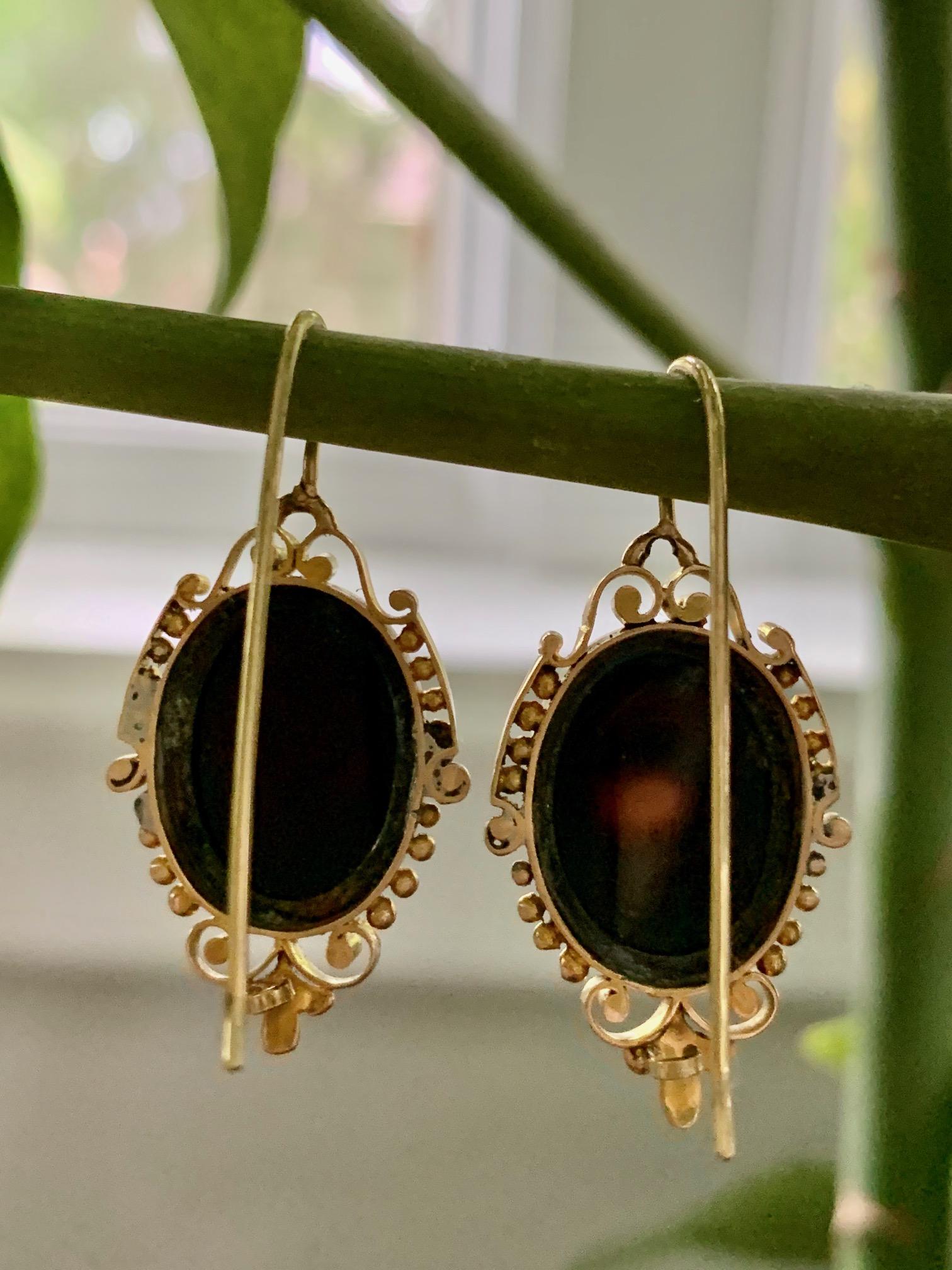 These Victorian Cameo earrings are carved in stone and set in 14k yellow Gold.  they are for pierced ears using a shepherd's hook ear wire.

They measure 27 x 18mm.

Weight 10.6 grams