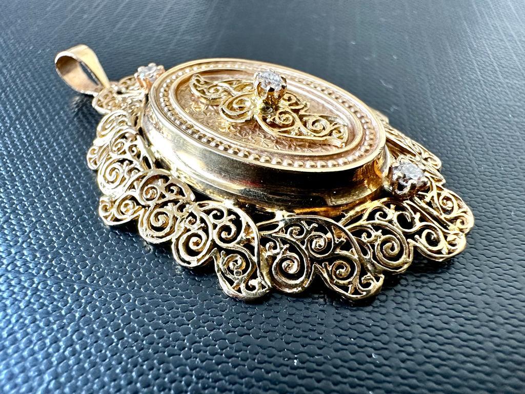 Introducing a breathtaking Victorian Style 18Karat Yellow Gold Hand-Chiselled French Pendant with Diamonds, a masterpiece that exudes timeless elegance and exceptional craftsmanship. This extraordinary pendant captures the essence of the Victorian