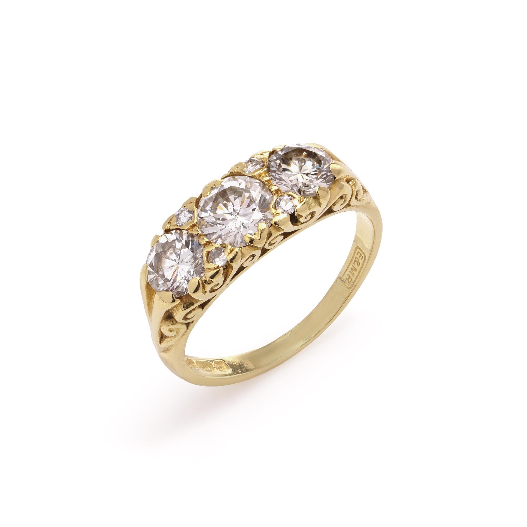 In homage to the elegant aesthetics of the Victorian era, this stunning ring is crafted in Victorian style of 18kt  yellow gold, exuding timeless sophistication. The central feature of this exquisite piece is a trio of dazzling diamonds, delicately