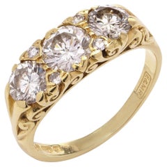 Retro Victorian style 18kt yellow gold three - stone diamond ring
