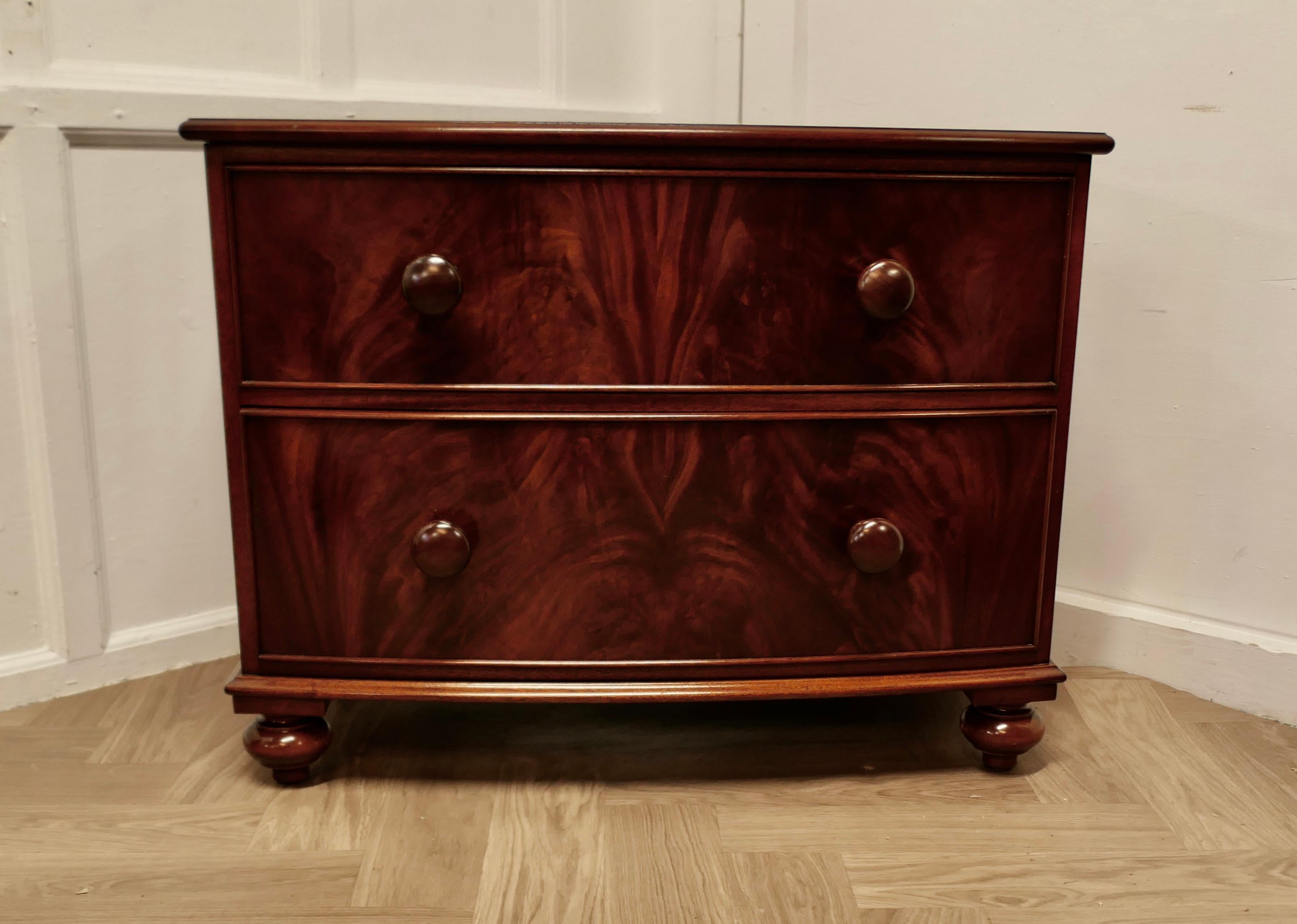 Victorian Style 2 Drawer Chest of Drawers 

The chest of drawers has a slightly bowed front, it has 2 large deep drawers with turned wooden knobs

The chest is in very good condition, it has a good colour and lovely patina. 
The chest is 27.5 ”