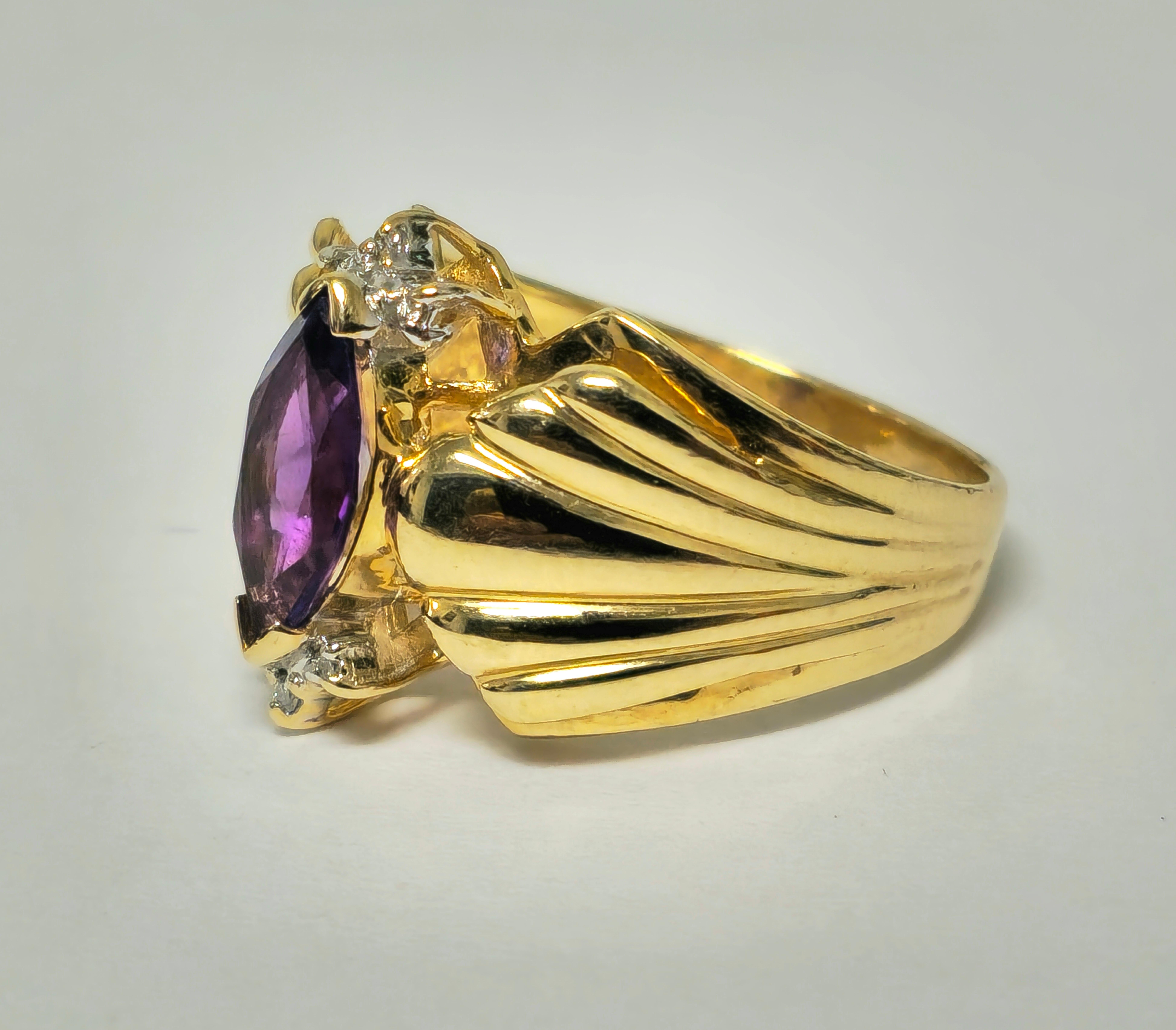 Elevate your style with our Vintage Victorian Fine Jewelry Cocktail Ring, featuring a captivating 2.30 carat marquise-shaped amethyst and 0.10 carats of round-cut diamonds. Crafted from luxurious 14k yellow gold, this ring exudes timeless elegance
