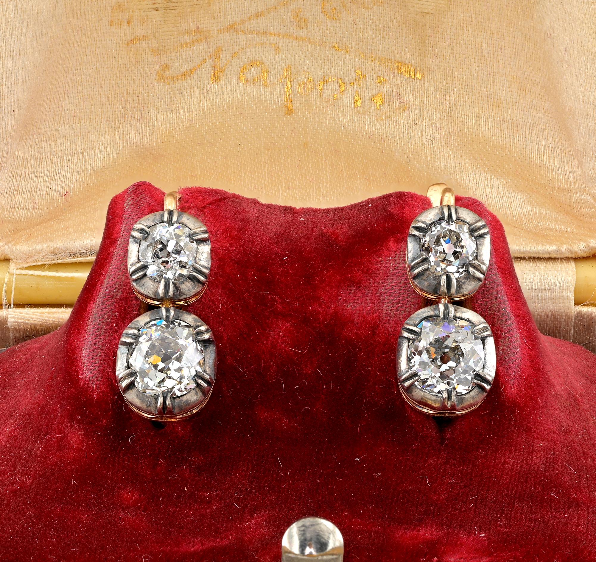Superb pair of good sized Diamond drop earrings superbly hand crafted of solid 18 Kt gold topped by silver
Classy Victorian style design with a gorgeous open work and darkened silver pie setting giving life to a combination of antique Diamonds