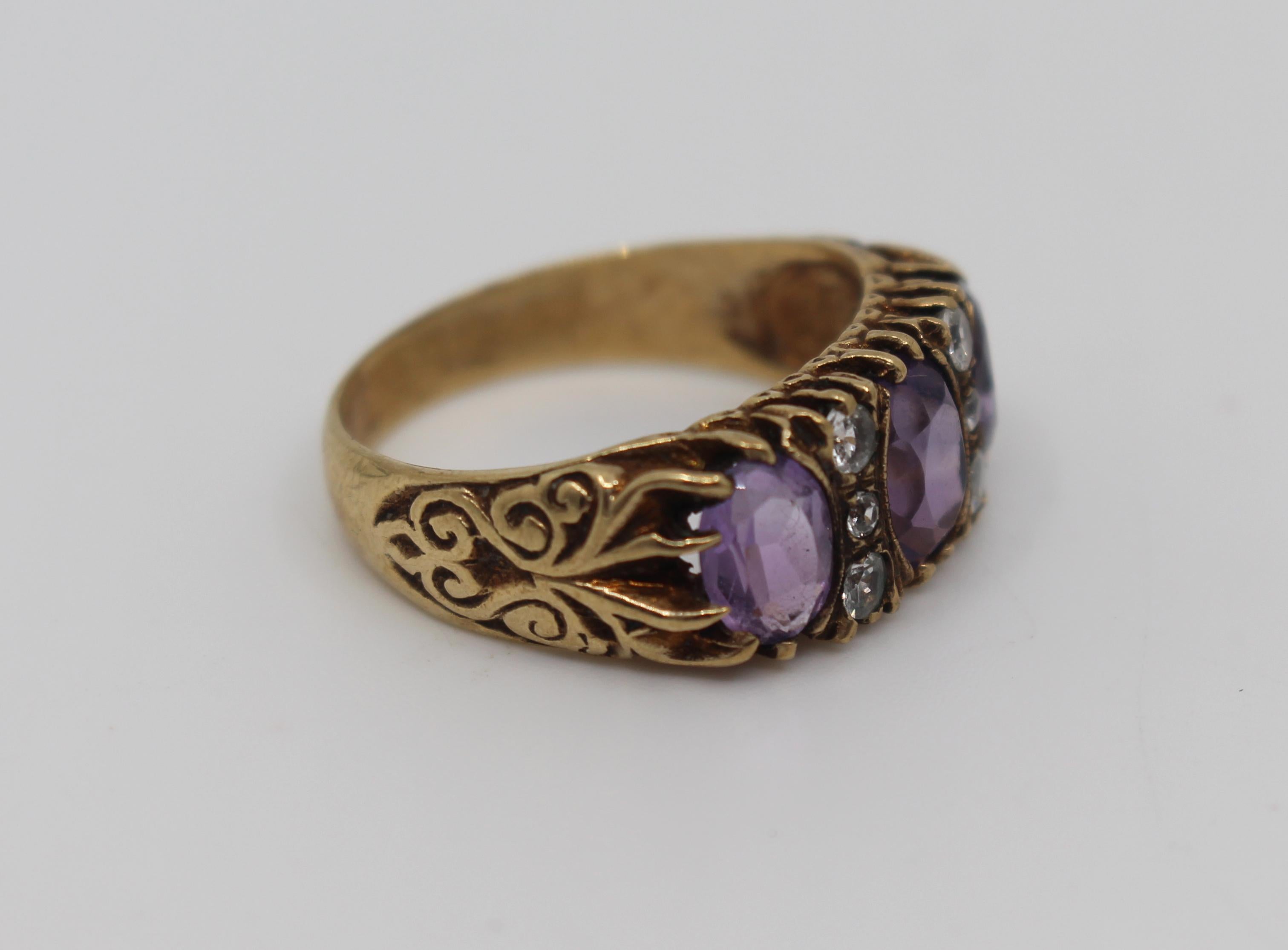 Period 
20th century, vintage

Hallmark Birmingham, dated 1972
Stones 3 amethysts, interest with gemstones probably spinel’s
Gold 9-carat rose gold, fully hallmarked
Weight 5 g
Ring size R 1/2 (UK), 9 (US)
Condition: Very good vintage